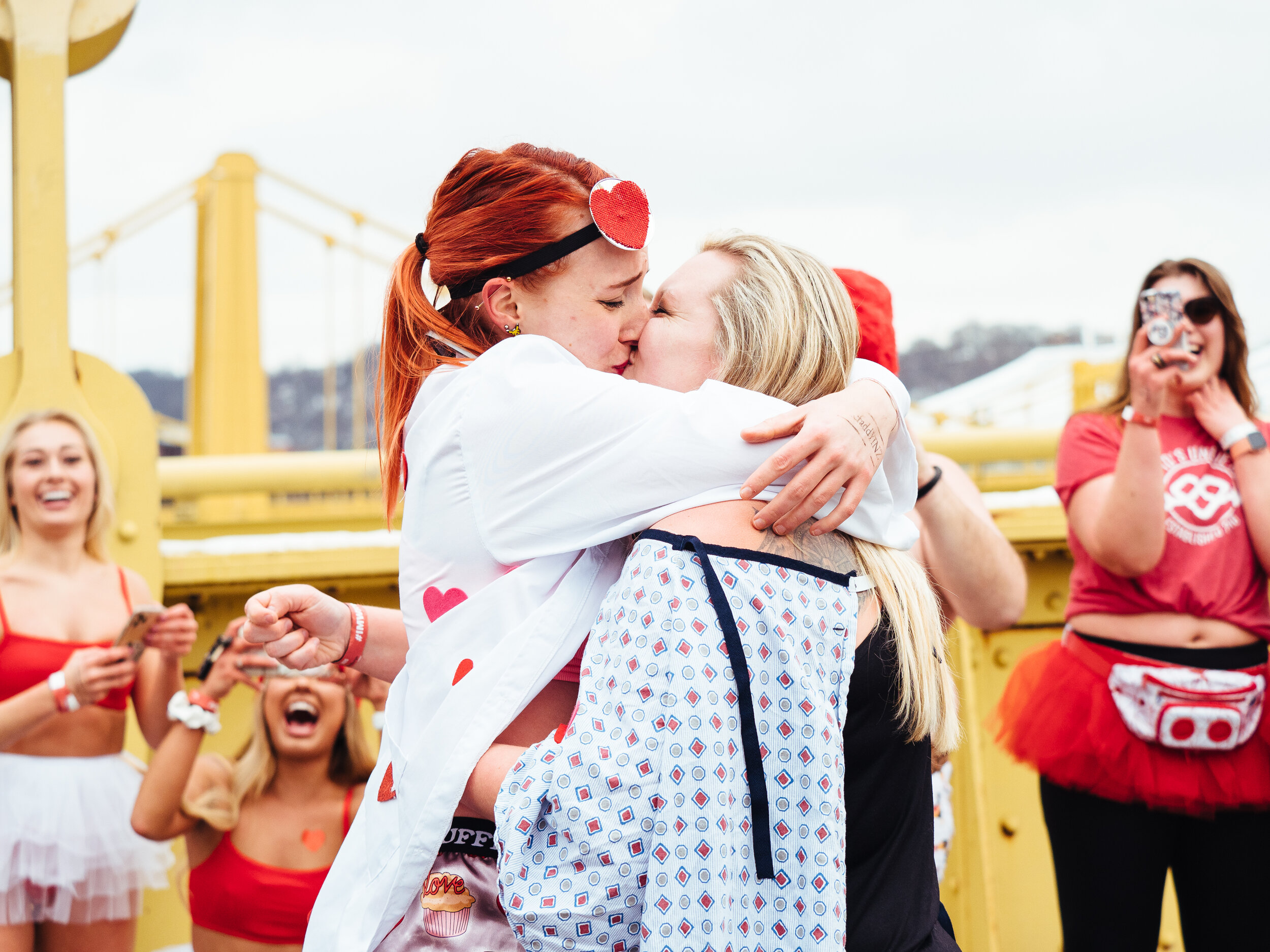  Theresa Maxon, 27, of Morgantown (right) shares a kiss with Marcie Koenig, 26, of Pittsburgh after Maxon proposed to Koenig on the Robert Clemente Bridge during Cupid’s Undie Run on Saturday, Feb. 8, 2020.  