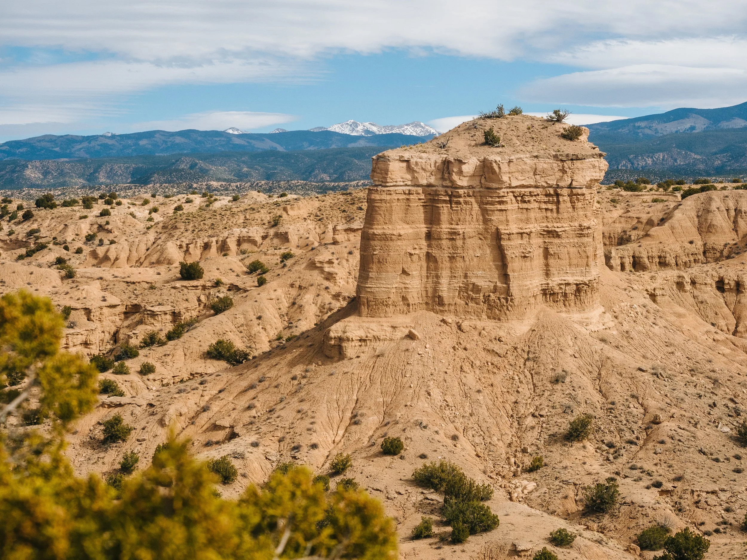   The Nambe Badlands stand in front of the Sangre De Cristo Mountains.  