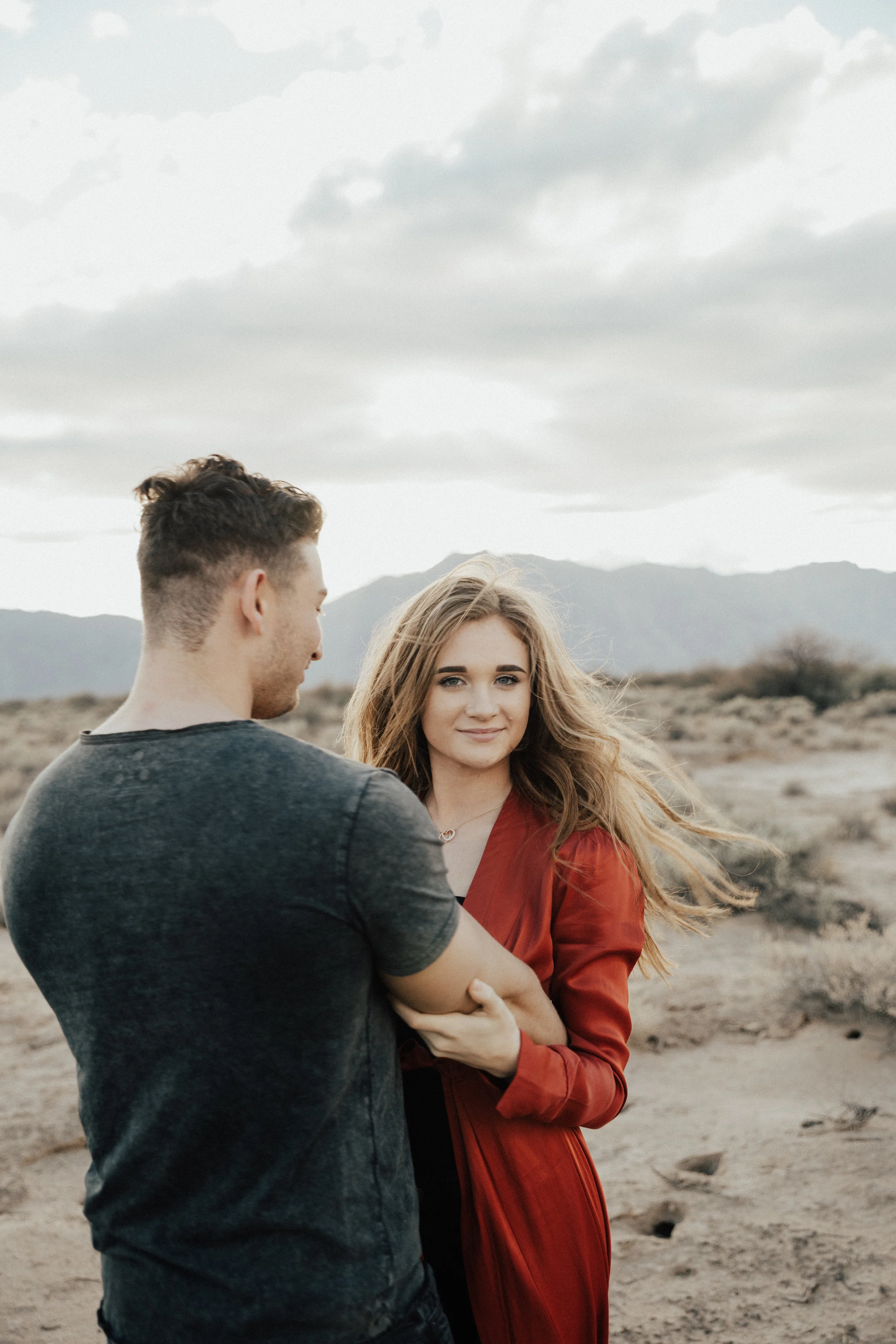 For this photo I told my clients to do "Ring Around the Rosie " instead of holding hands, hold her behind her waist and grab his arm, start to spin around and focus on my lens when you are facing me.