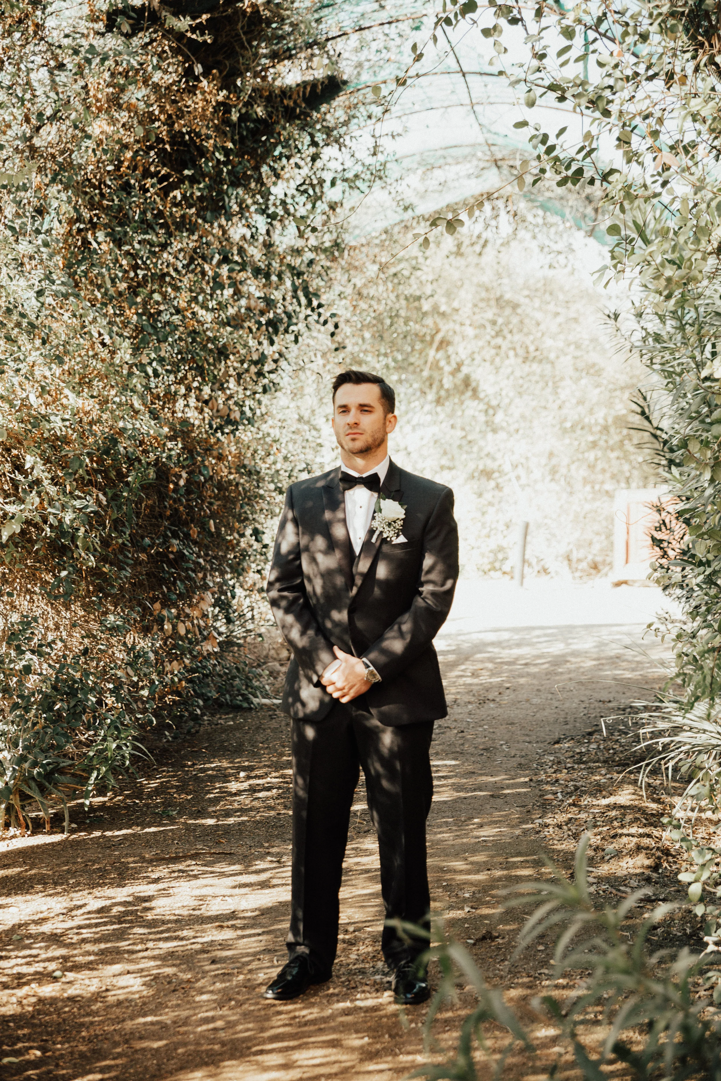 The groom waits knowing his bride is on her way. 