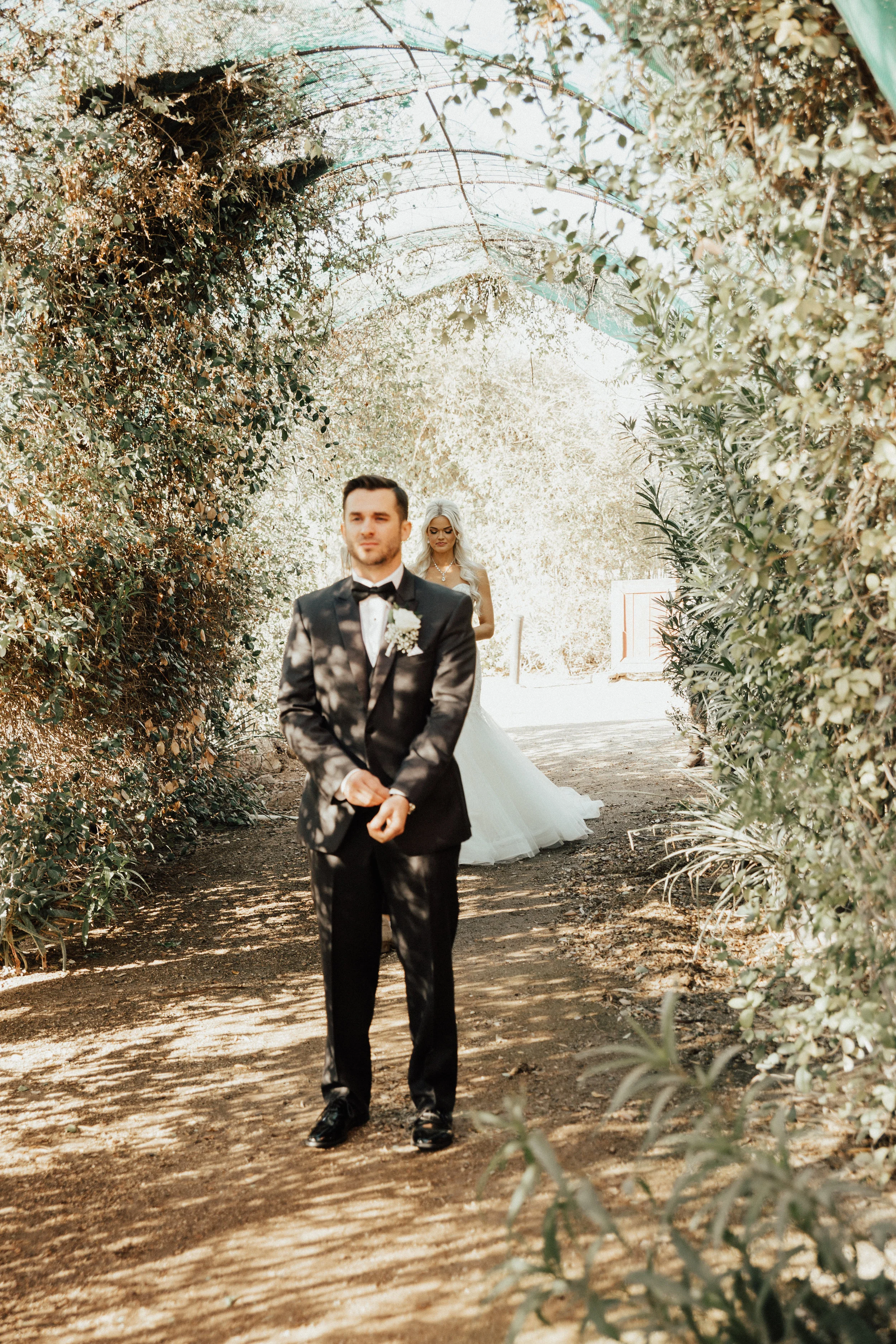 She's behind him and they both have not looked at each other yet, which by the way is a super exciting moment. 