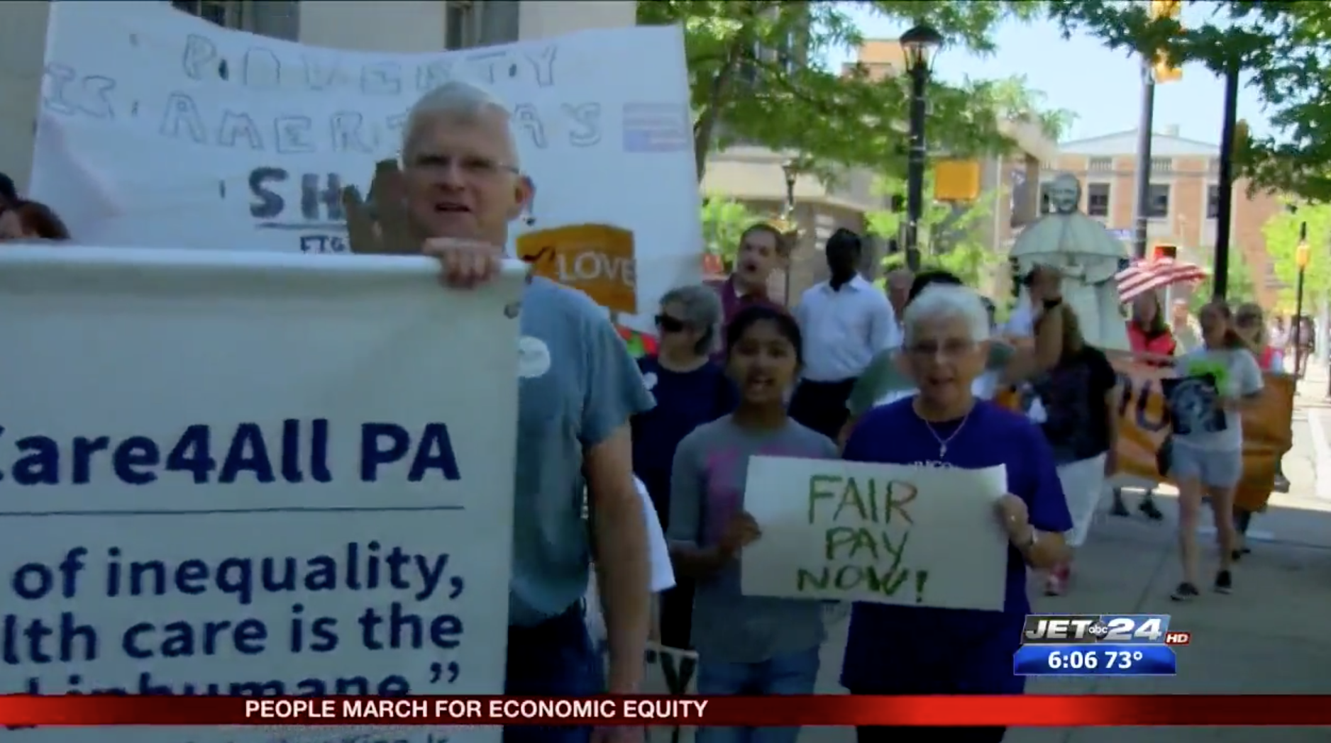 In this great shot showing the march, the orange ErieViaduct banner can be seen in the far right, just below the flag. This is a screen shot from Ron Hillard's Jet24 story today.