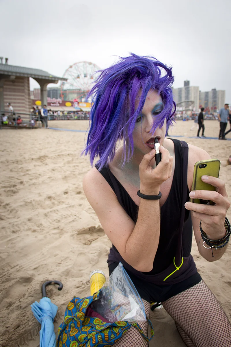 Gay guy putting on lipstick on beach a bit edited 2_better.jpg