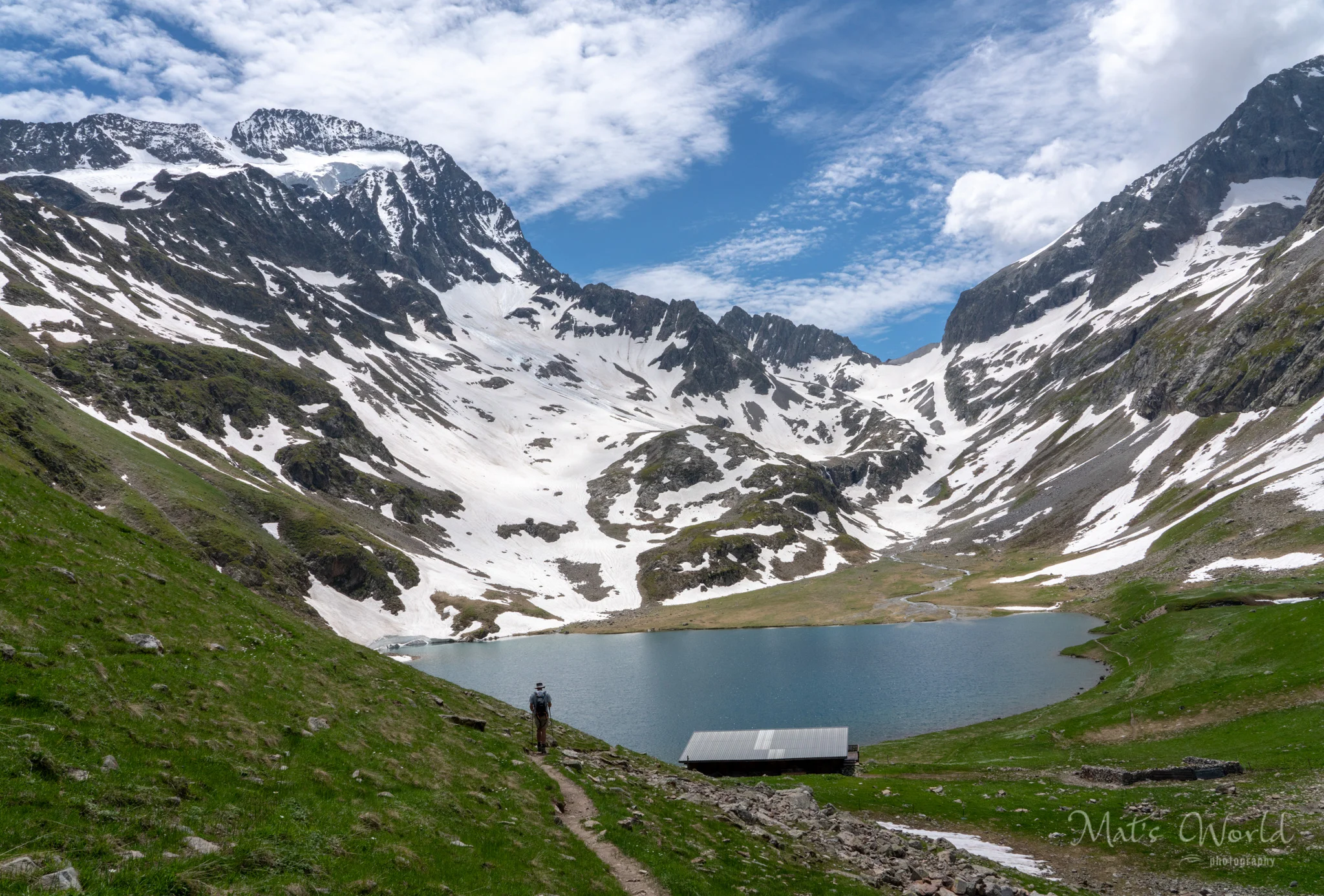 Shawn looking down at Lac de la Muzelle, with the Refuge just above it.