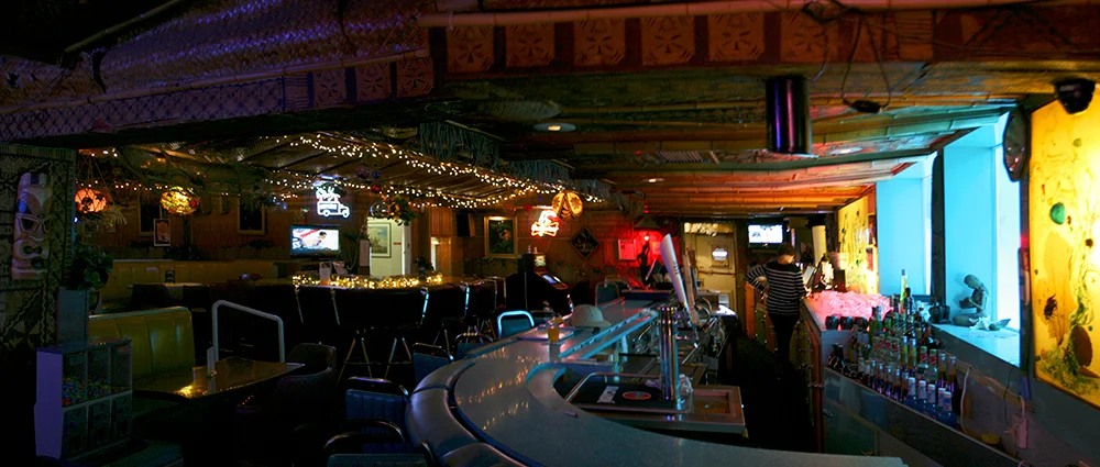 A panoramic of the lounge from the west wall, near the slot machines and video poker games.
