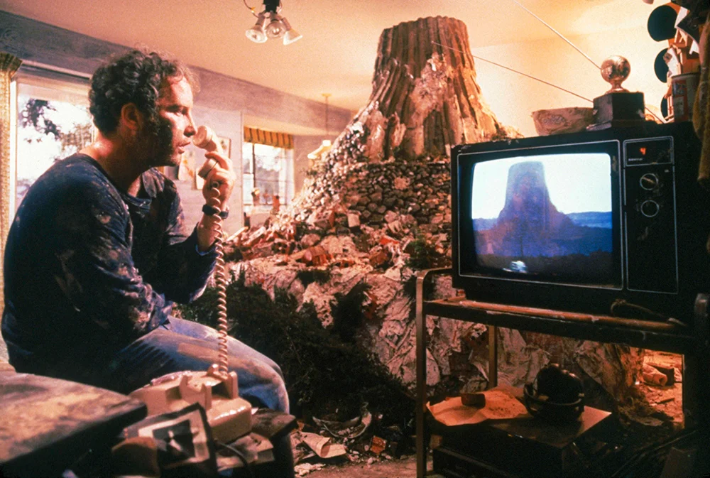 Richard Dreyfuss as Roy Neary, experiencing the Tower just as we do, through media. 