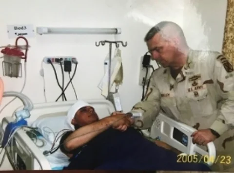 Hardly conscious receiving his Purple Heart, Bagdad Iraq. 