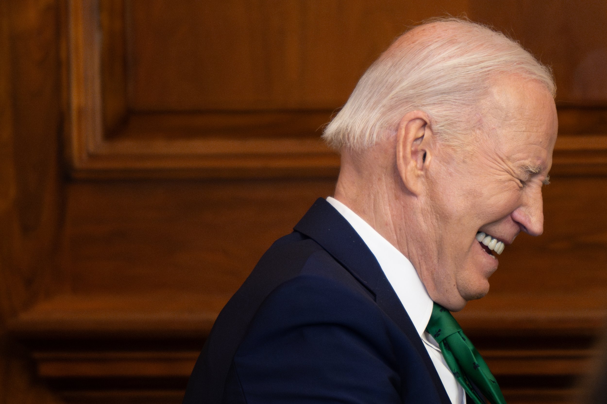 President Joe Biden laughs during remarks at the Friends of Ireland Luncheon on March 13, 2024.