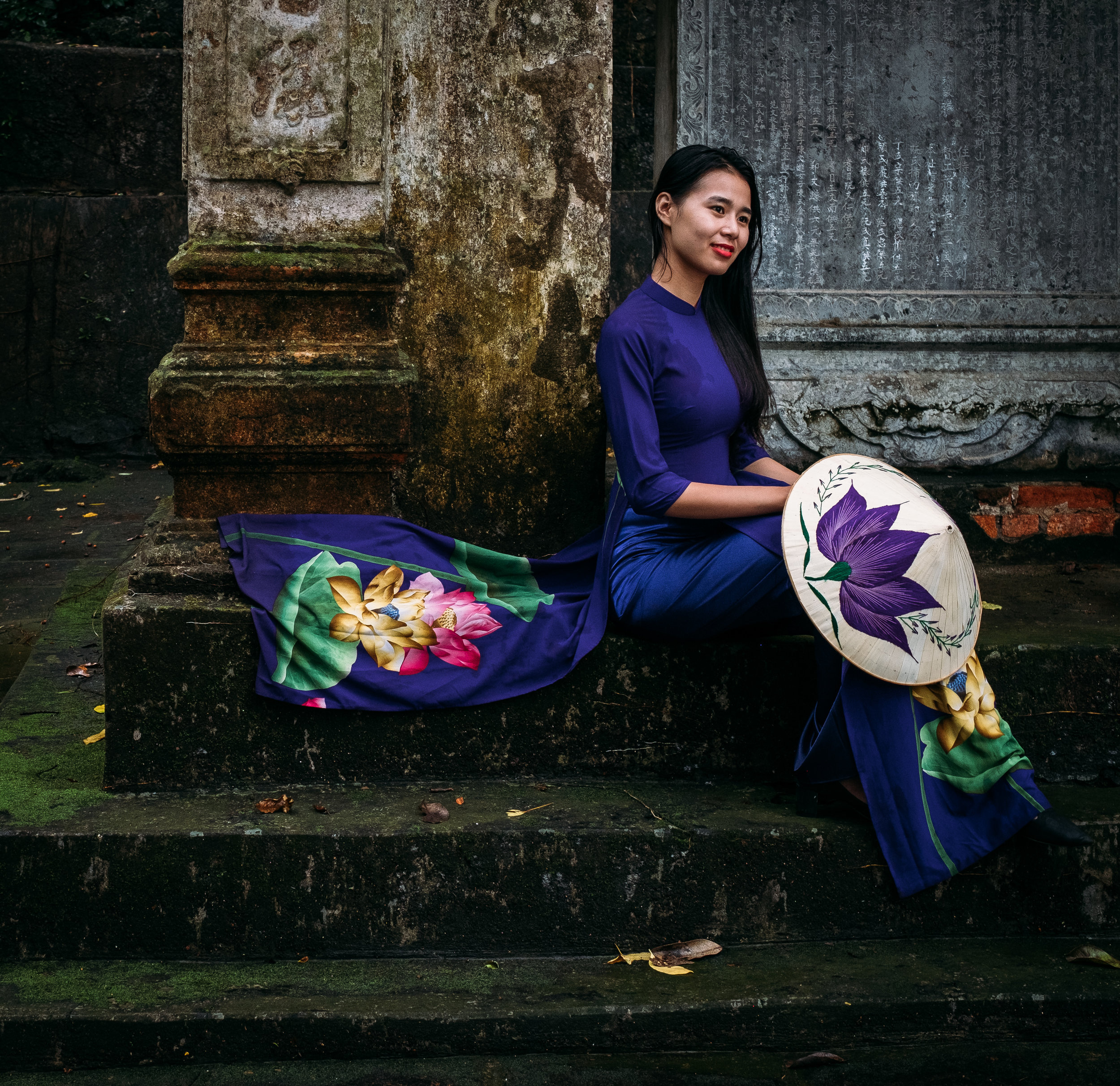 Vietnam girl wearing traditional ao dai dress in perfume pagoda