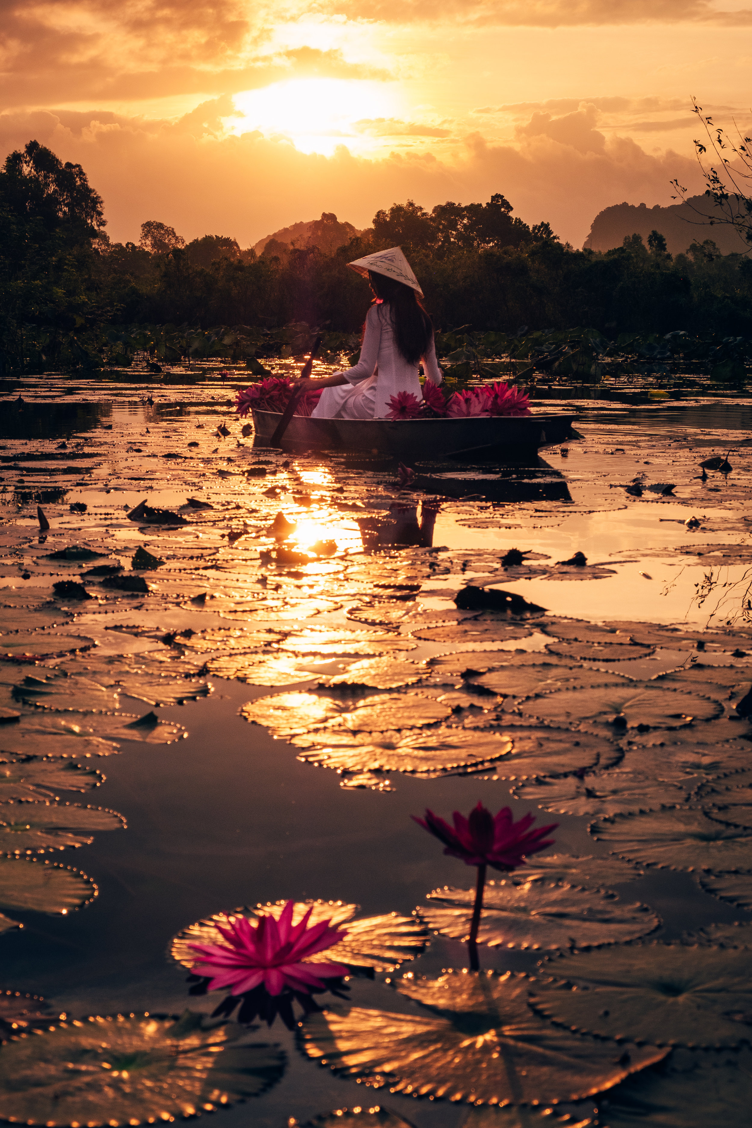 A boat riding during beautiful sunrise in perfume pagoda in viet