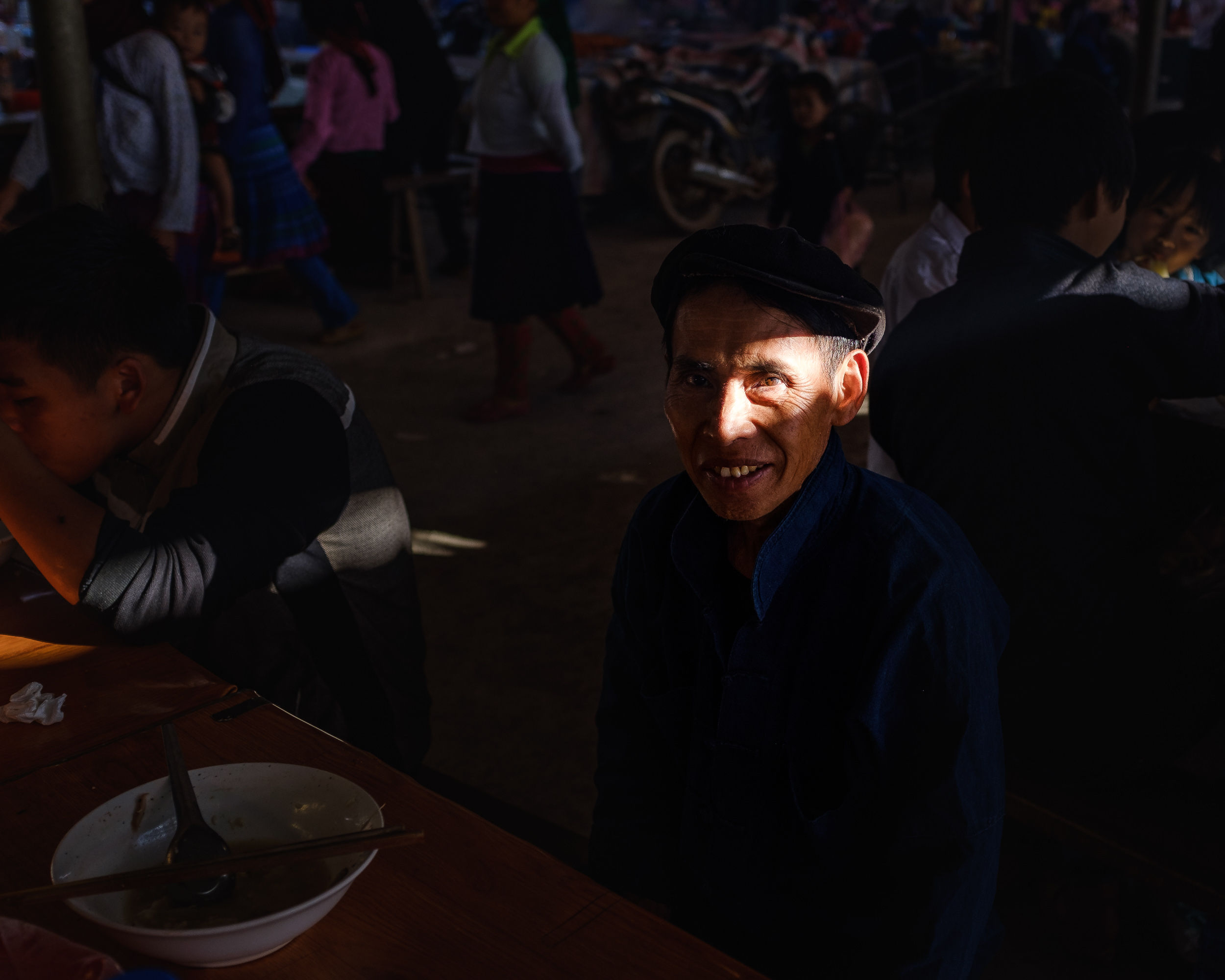  Morning light ray casting on a villager in Dong Van market in Northern Vietnam 