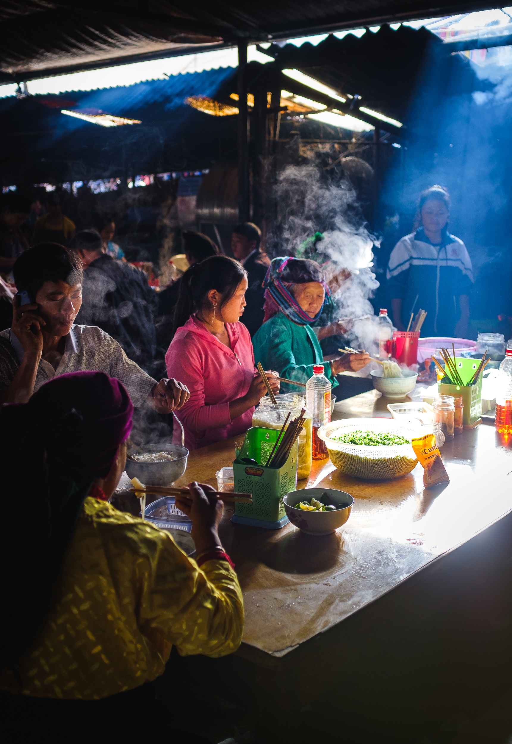  Visitors to the market having morning breakfast with Pho noodles in dong van market in Vietnam 
