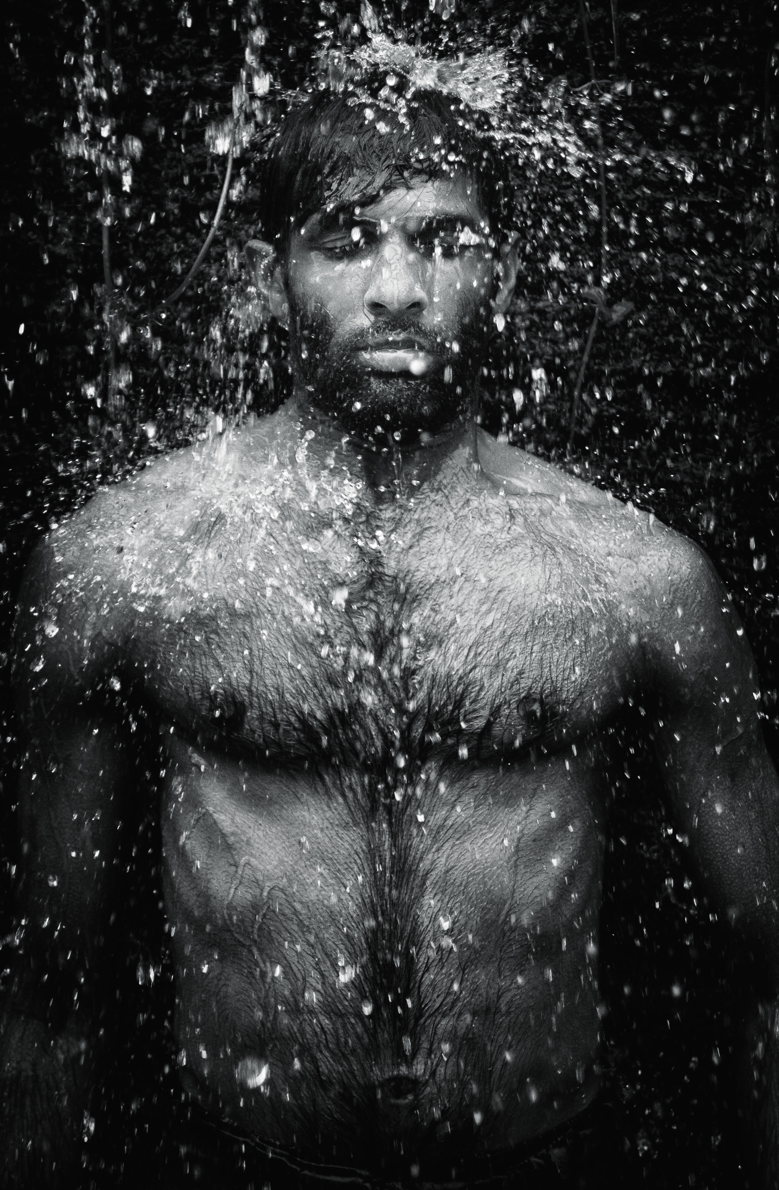 A man in deep state of inner consciousness under a small water s