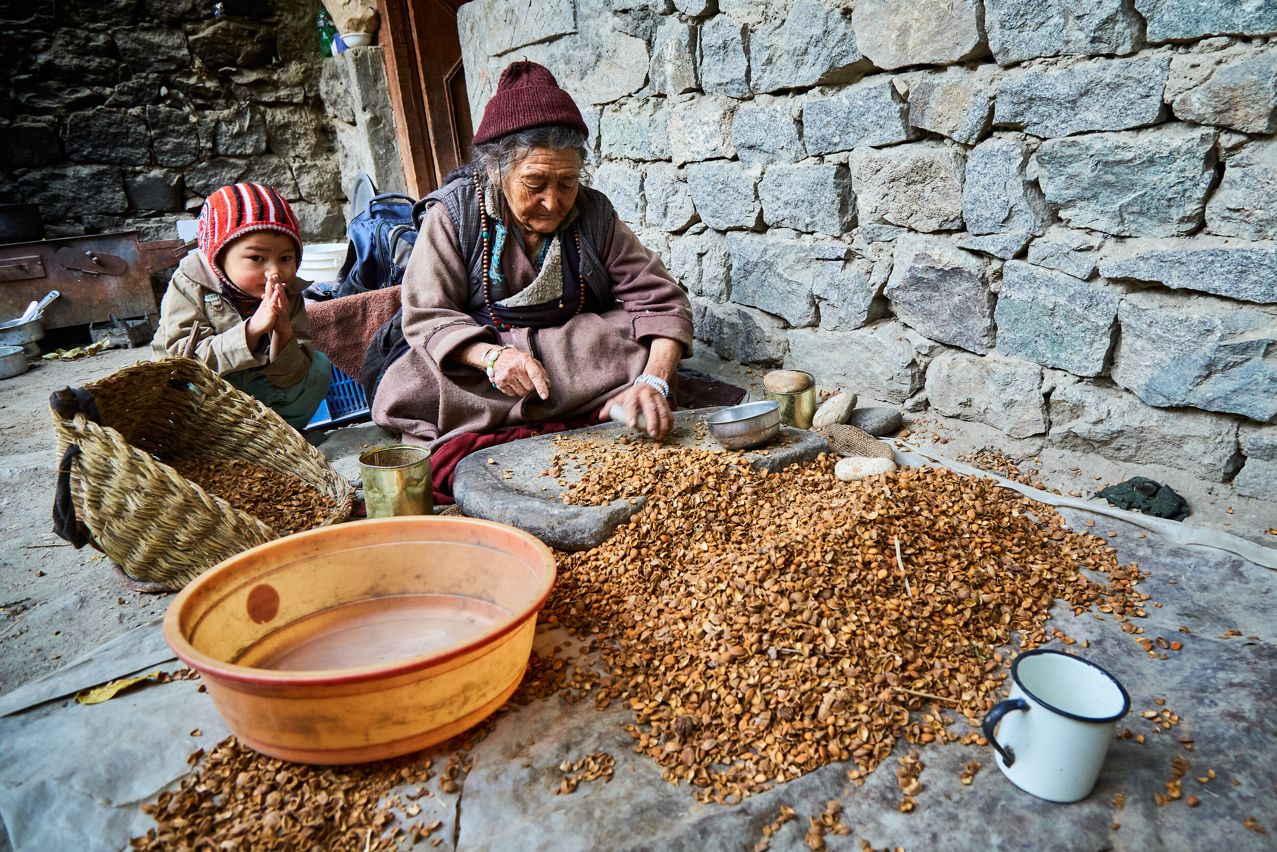  Old age is a common term in the region. Elders contribute significantly to the upkeeping of the family and mostly self dependant. An elderly women making almond oil. 