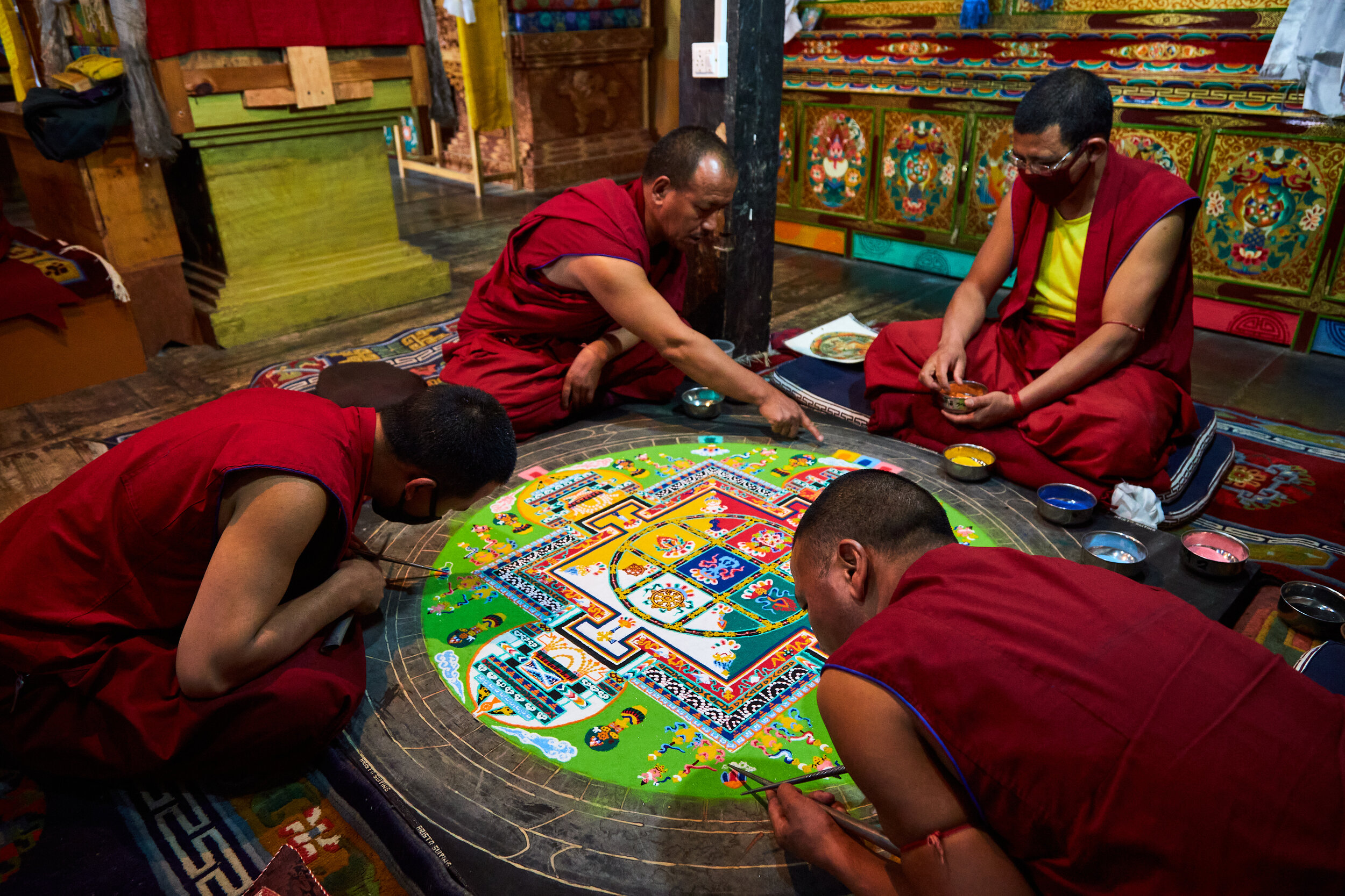  Mandala is a spiritual representation of the universe. Performing a mandala art is not a common occurrence, but a fascinating sight if one is lucky enough to be in the right place at the right time. Few monks creating mandala in Thiksey monastery. 