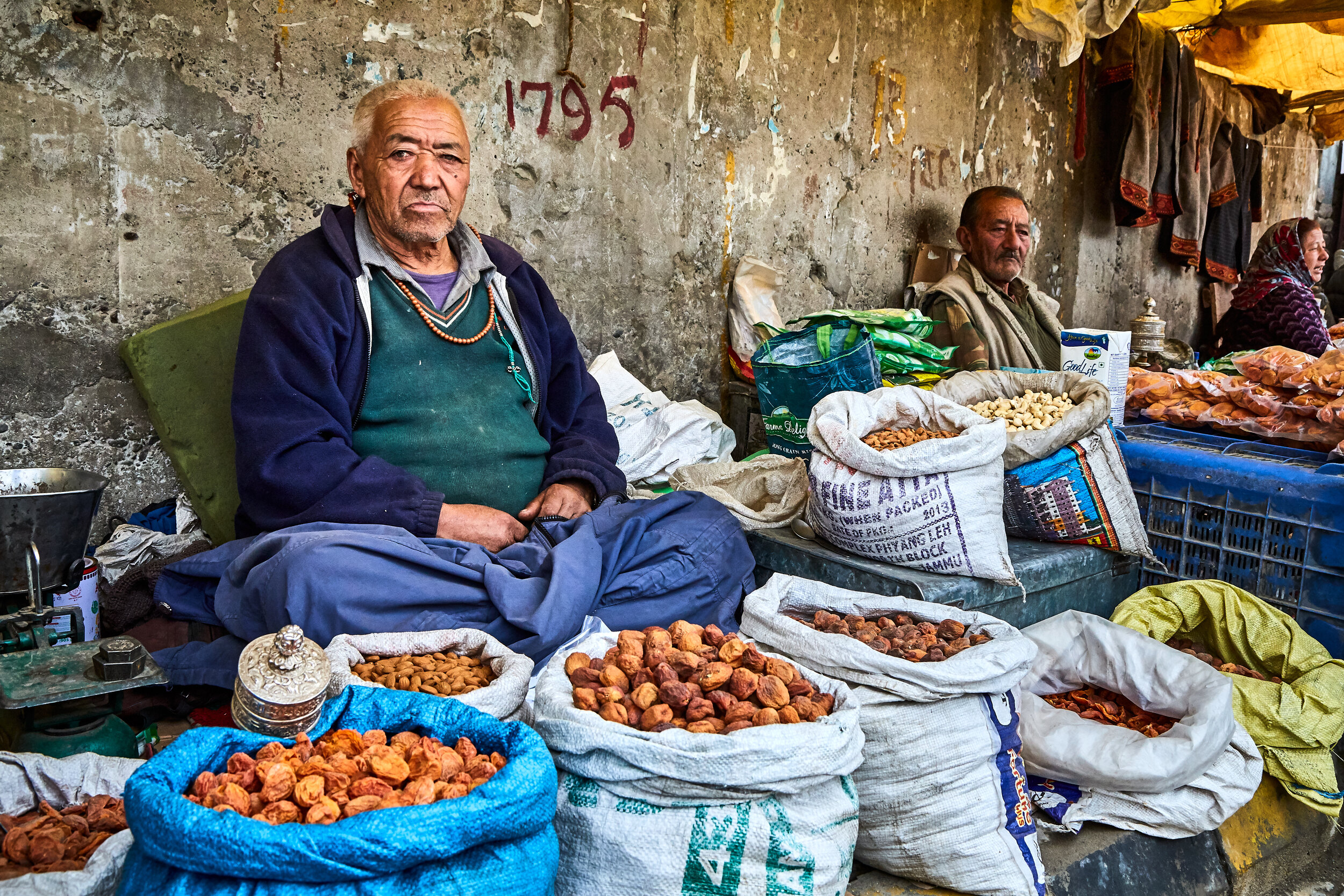  Markets in the capital city of Leh receive produce from all over the region and far away from other parts of India. A dried fruit seller in Leh. 