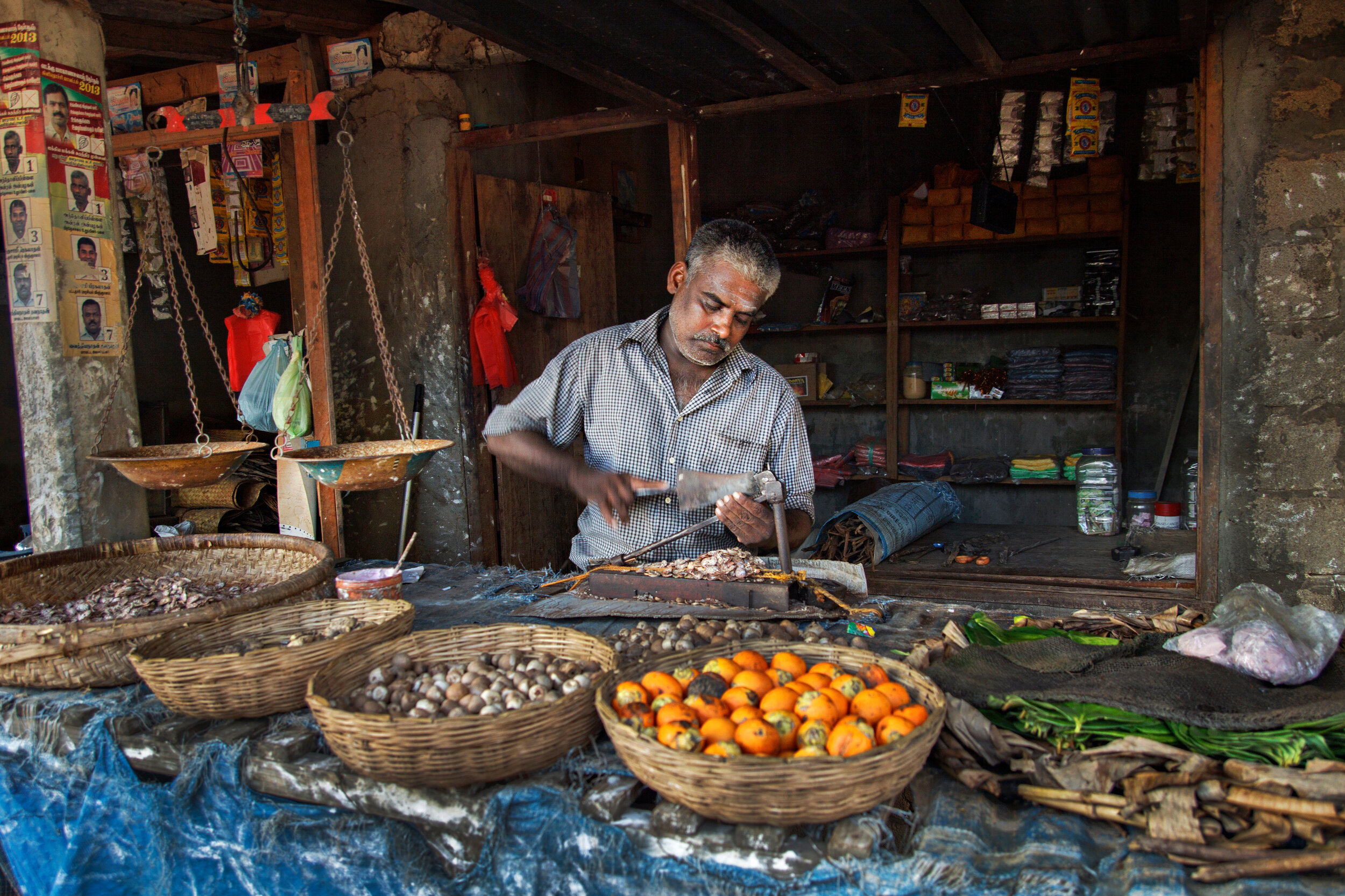 After decades long civil war in Sri Lanka, the lifes of people in the war affected areas are slowly returning back to the routine.This man, a betel nut and leaf seller, put up his own shop in a small market and mostly seen busy with cutting the nuts