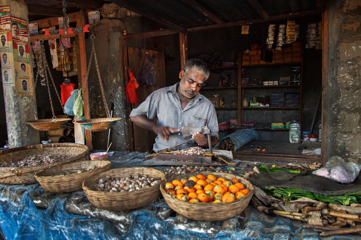  After decades long civil war in Sri Lanka, the lifes of people in the war affected areas are slowly returning back to the routine.This man, a betel nut and leaf seller, put up his own shop in a small market and mostly seen busy with cutting the nuts