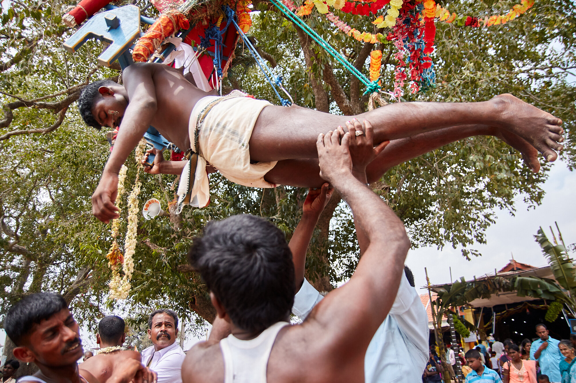  Often the rituals end up unexpectedly. Here a devotee just fainted while hanging on hooks. I once saw a man rushed into an emergency department where I worked as a medical officer with multiple fractures in all four of his limbs afte a fall from a s