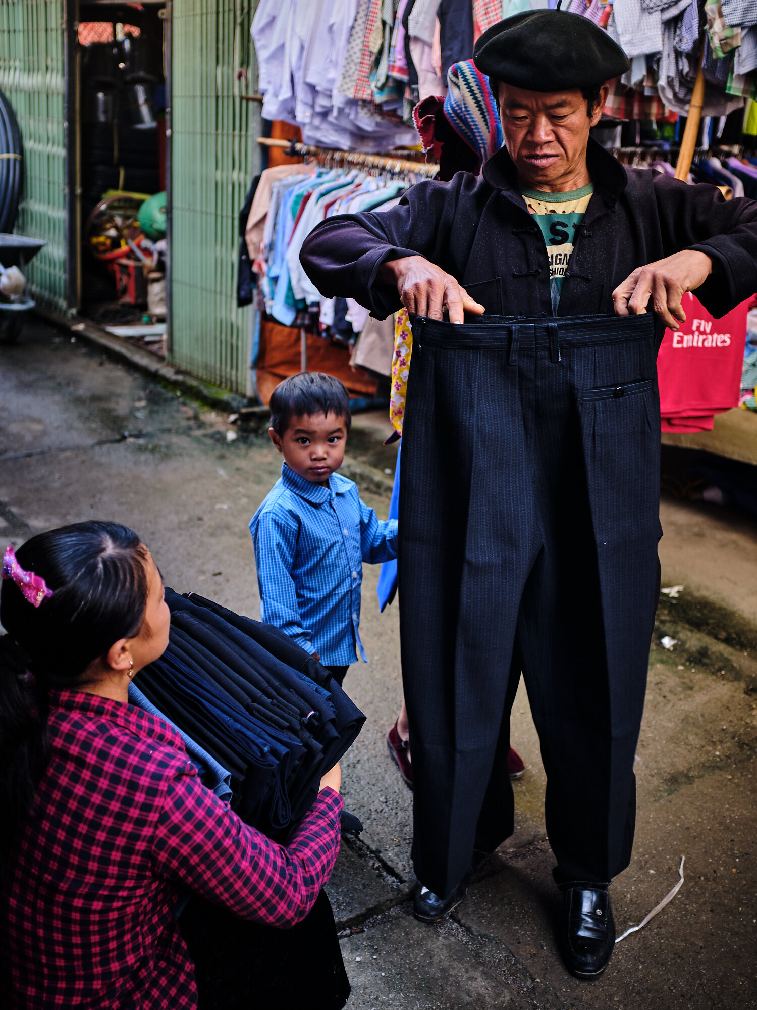  A villager sizing up a trouser 