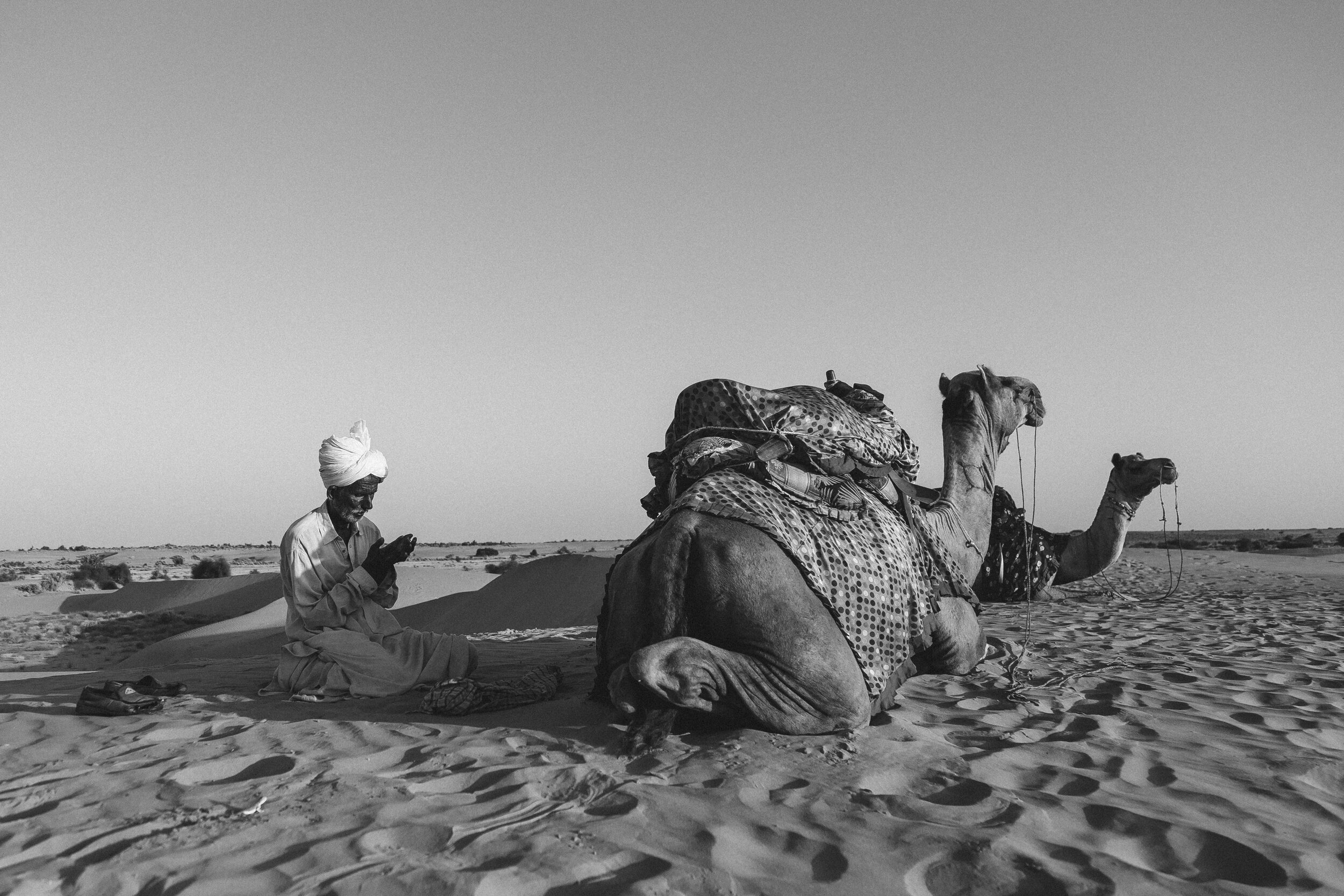 A camel rider in Sam desert dunes in Jaisalmer, Rajasthan taking