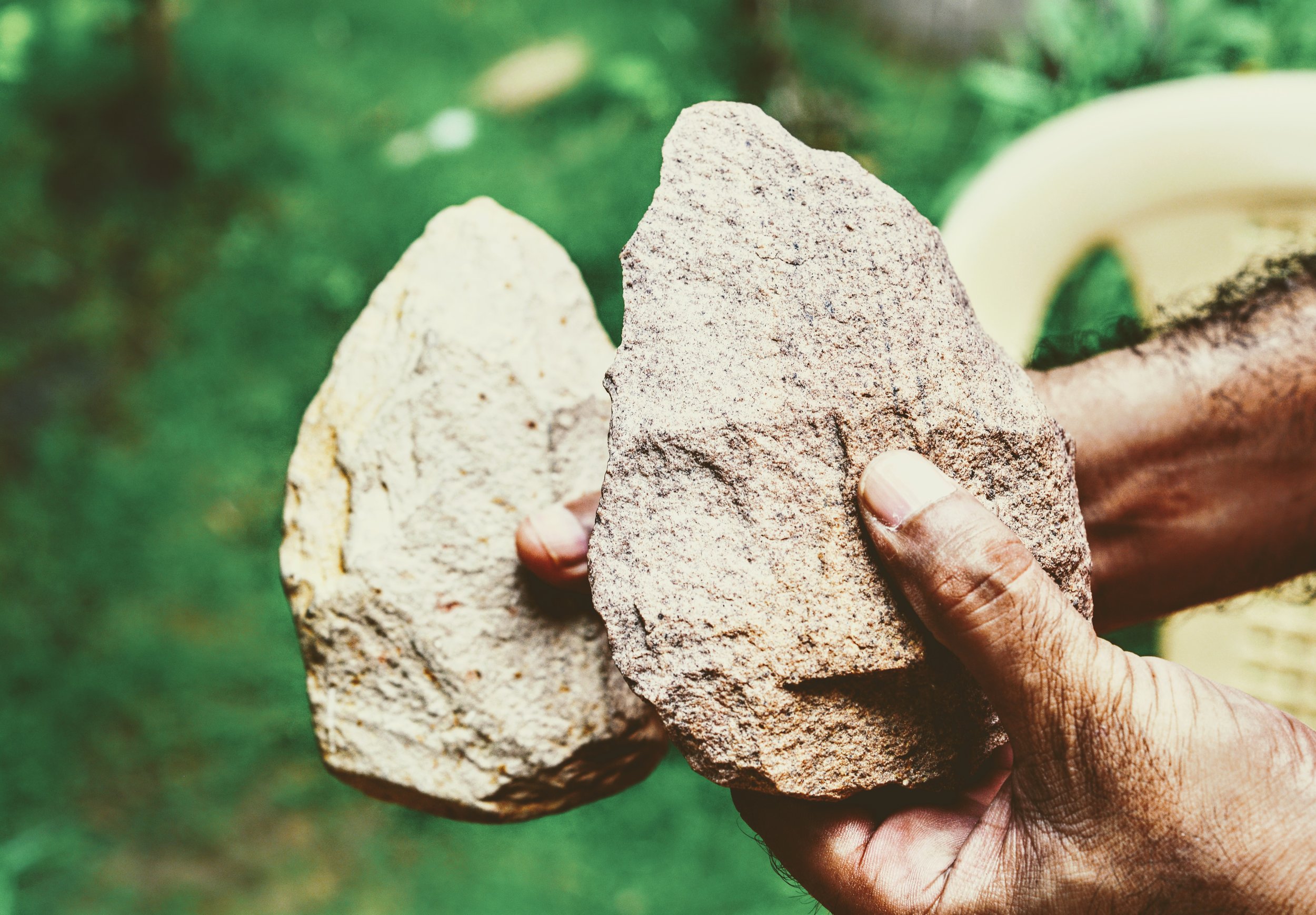 Handaxes are considered as early artistic creations of our ancestors. In the foreground is one made by Akhilesh, a copy of the prehistoric tool in the background that was found in Attirampakkam.