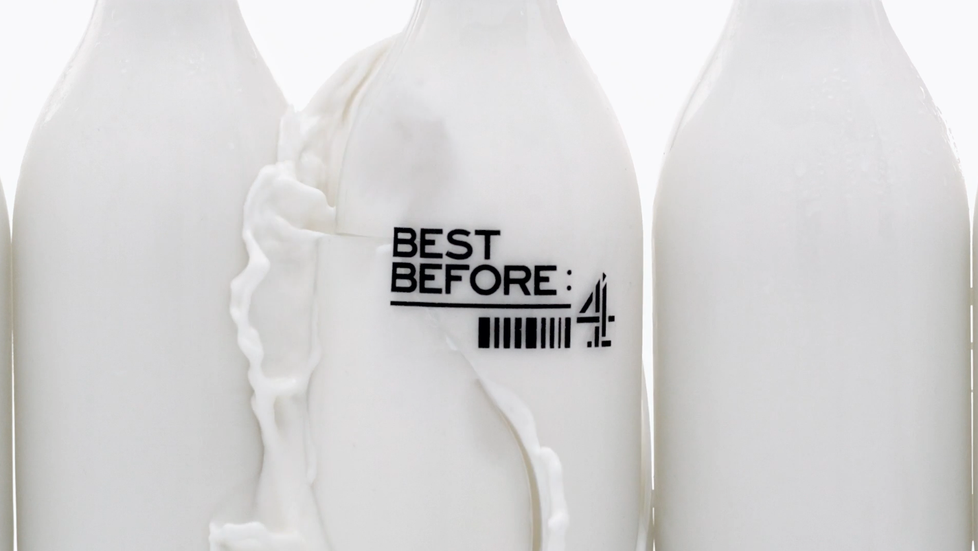 Close-up of bottles filled with milk, with one bottle displaying a "Best Before: 4" date label