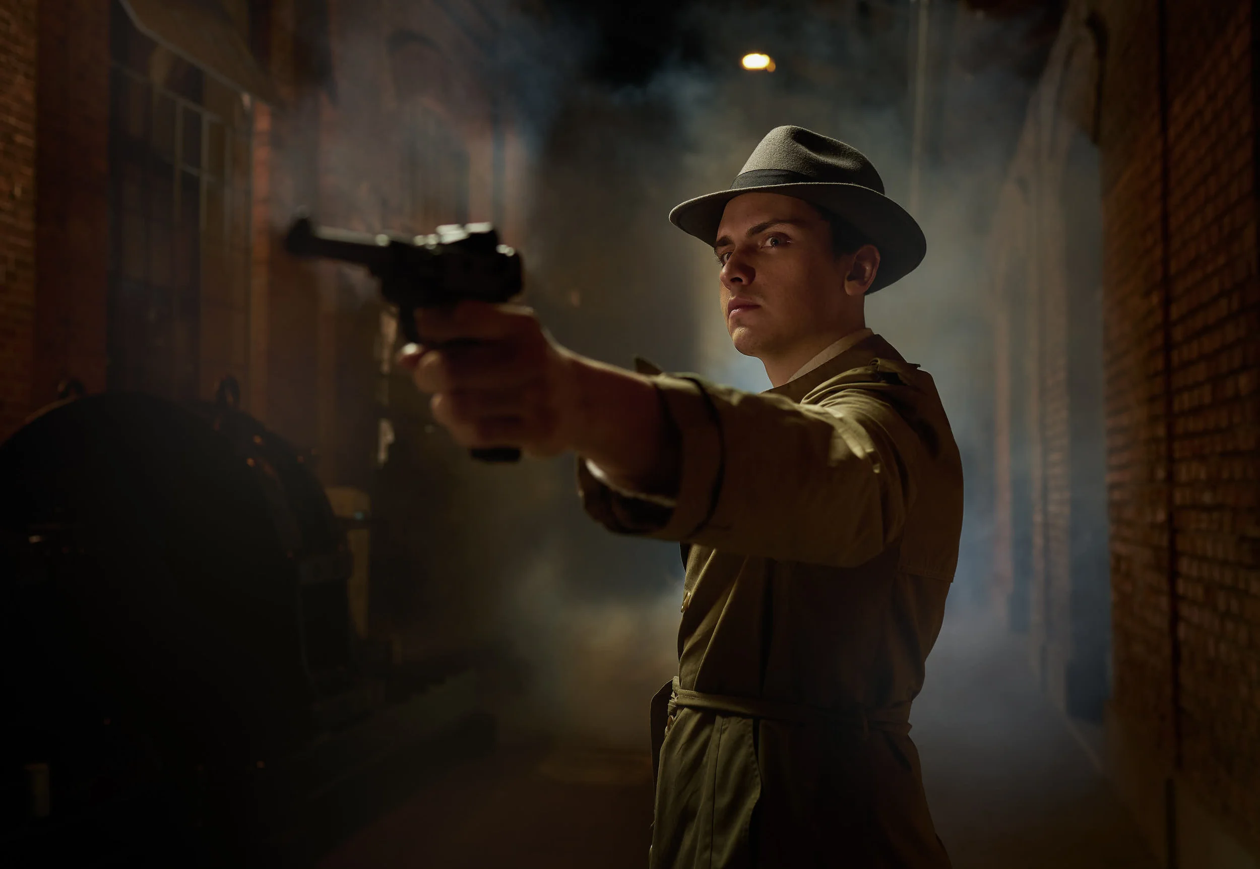 A man from the 50s pointing a gun