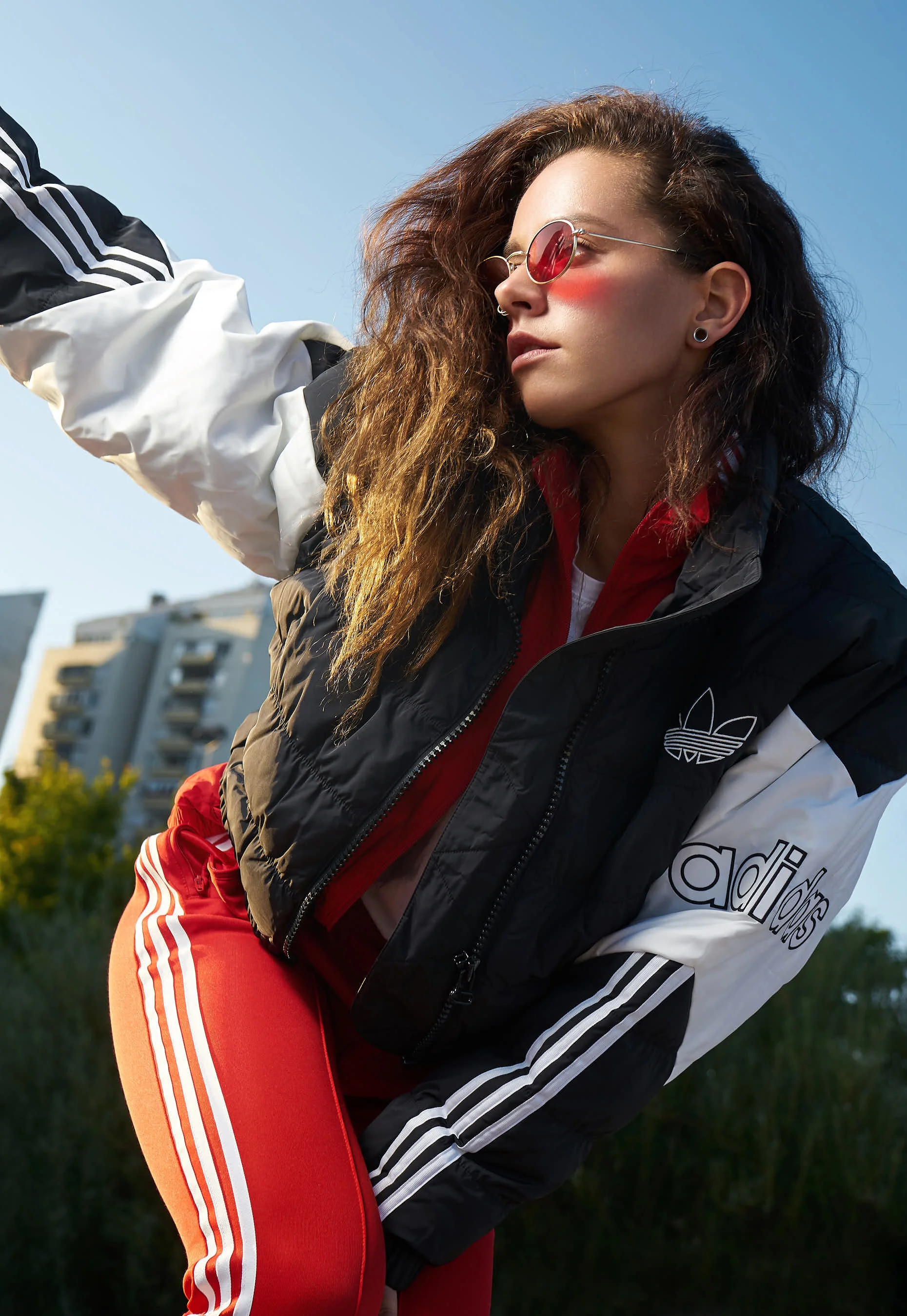 Portrait of an urban girl in adidas outfit by Baywer