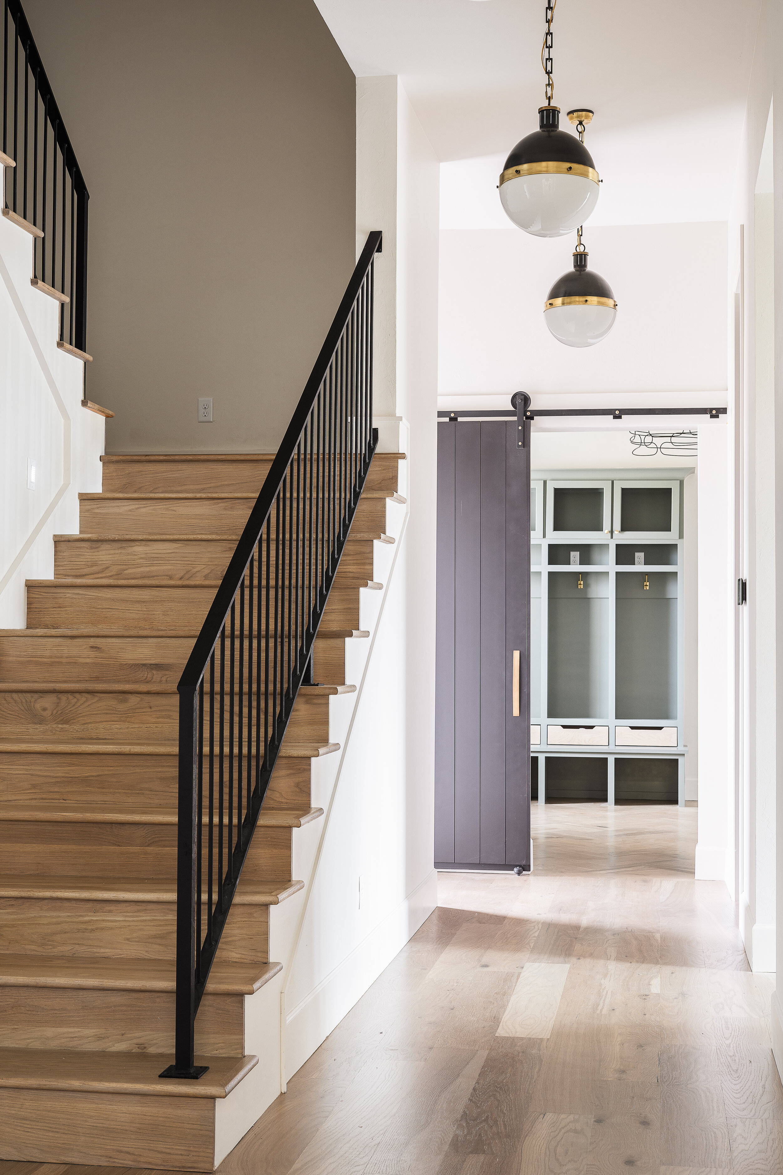 Gray barn door to utility room