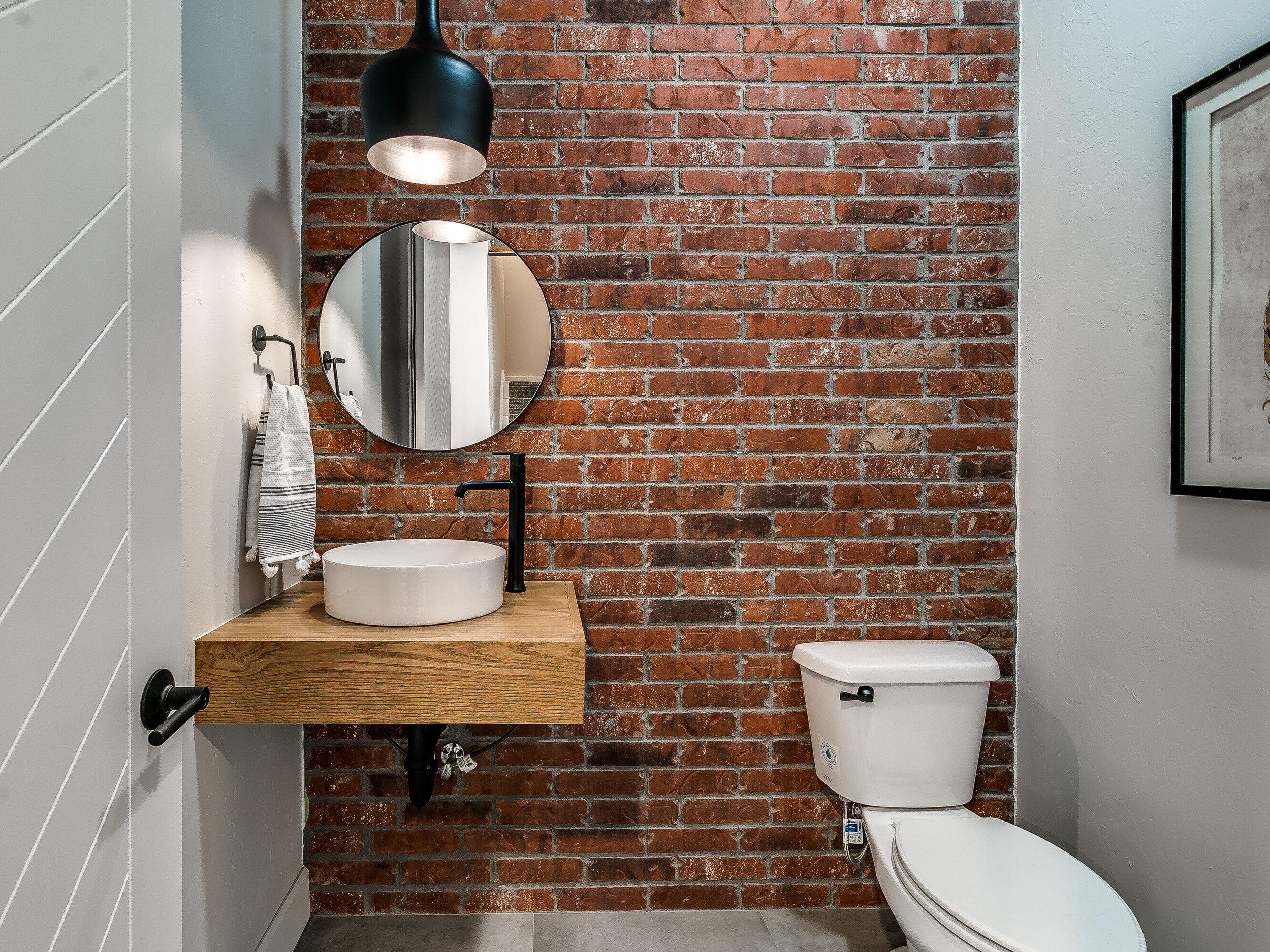 Red brick industrial powder room