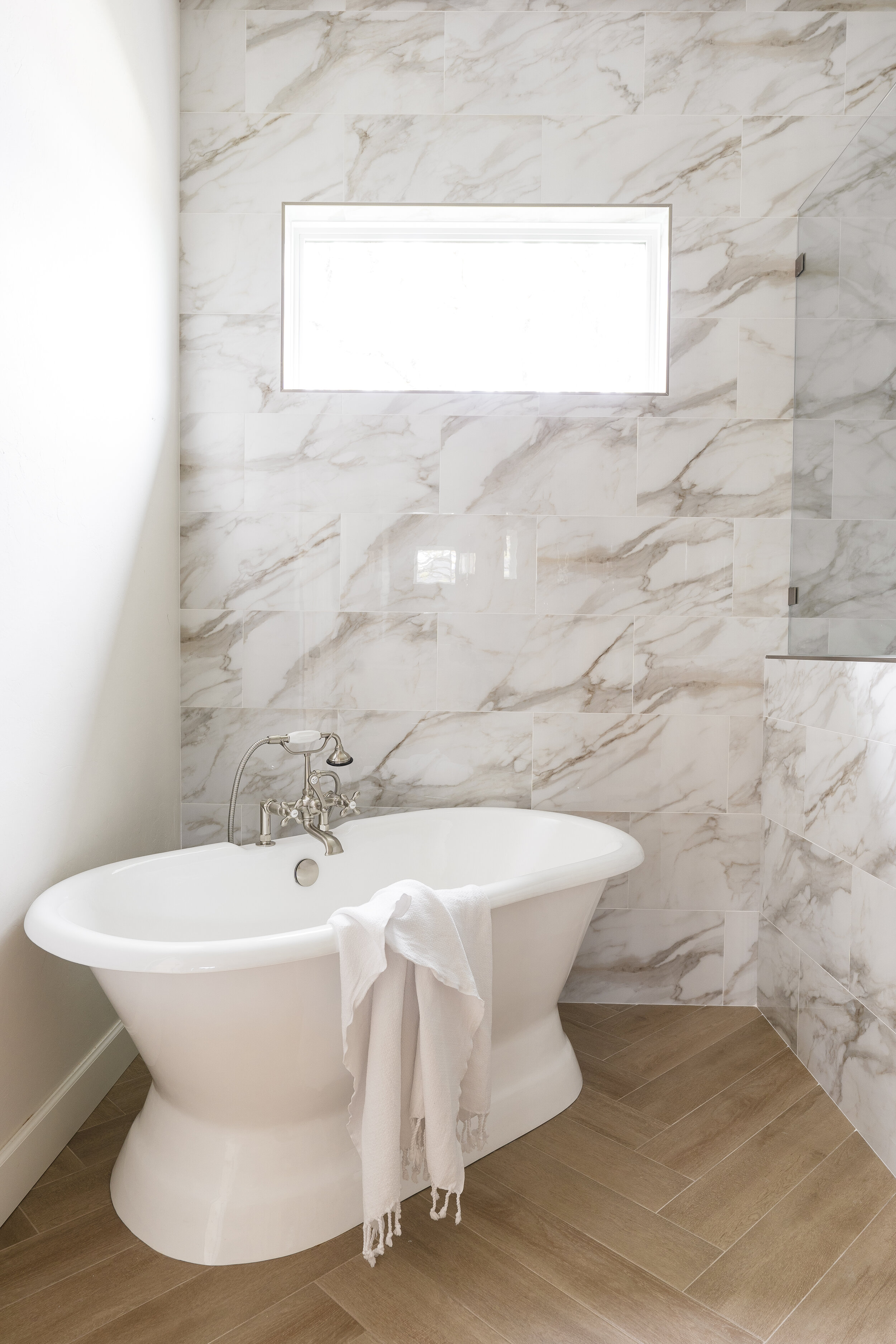 marble bathroom and white bathtub 