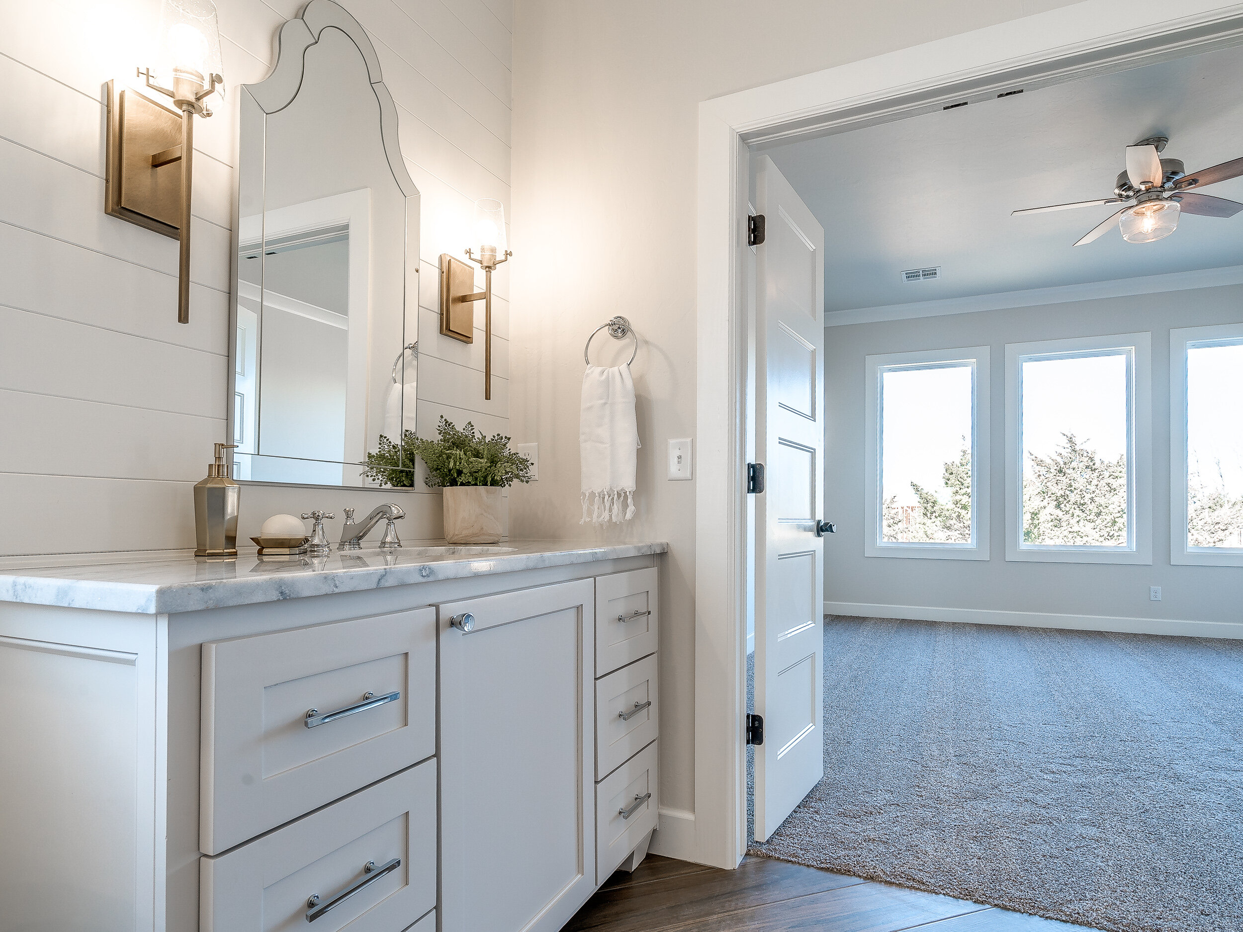 Light gray painted bathroom cabinets 