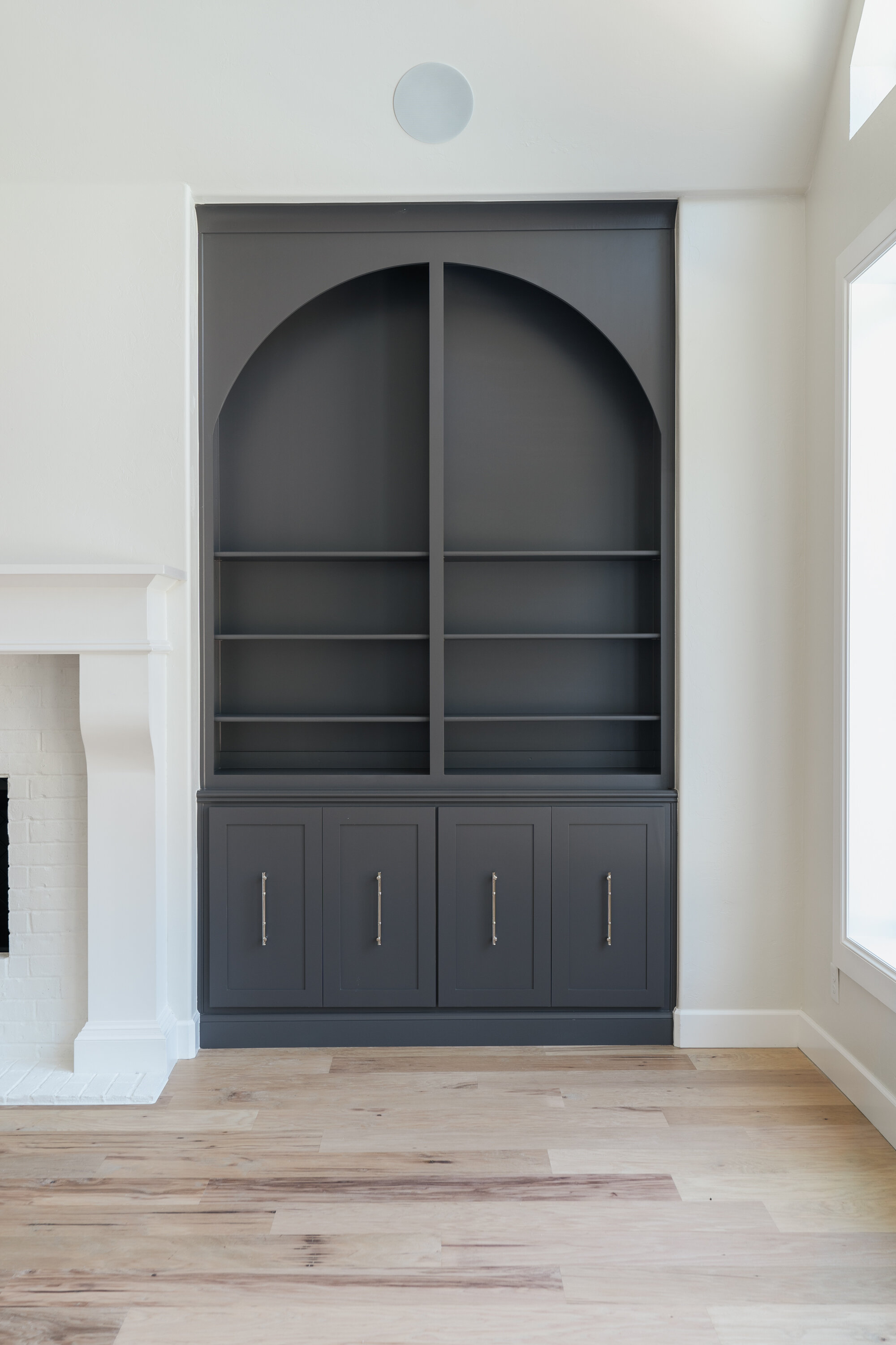 Black arch built ins in living room 