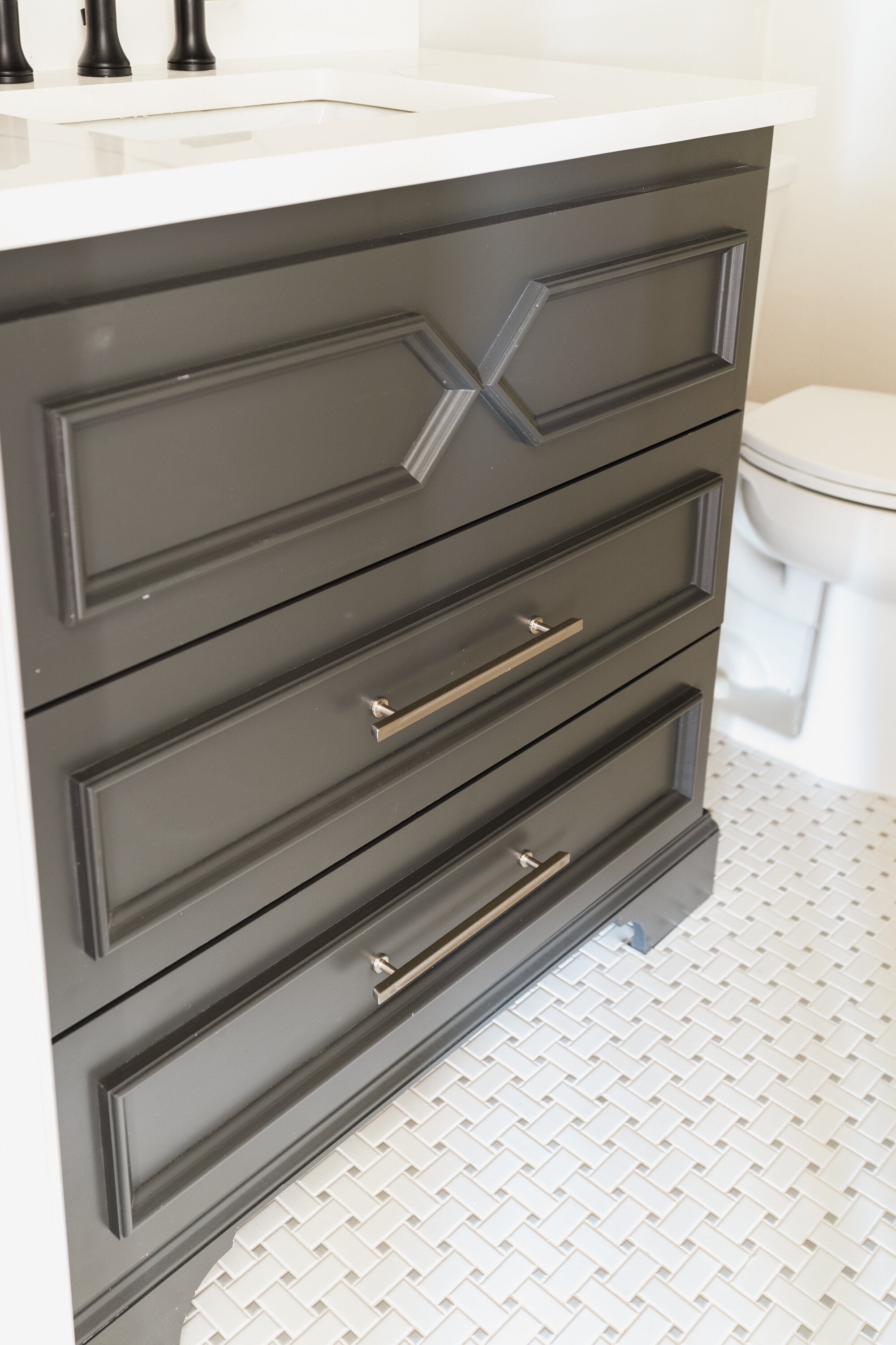 Painted black powder room cabinets