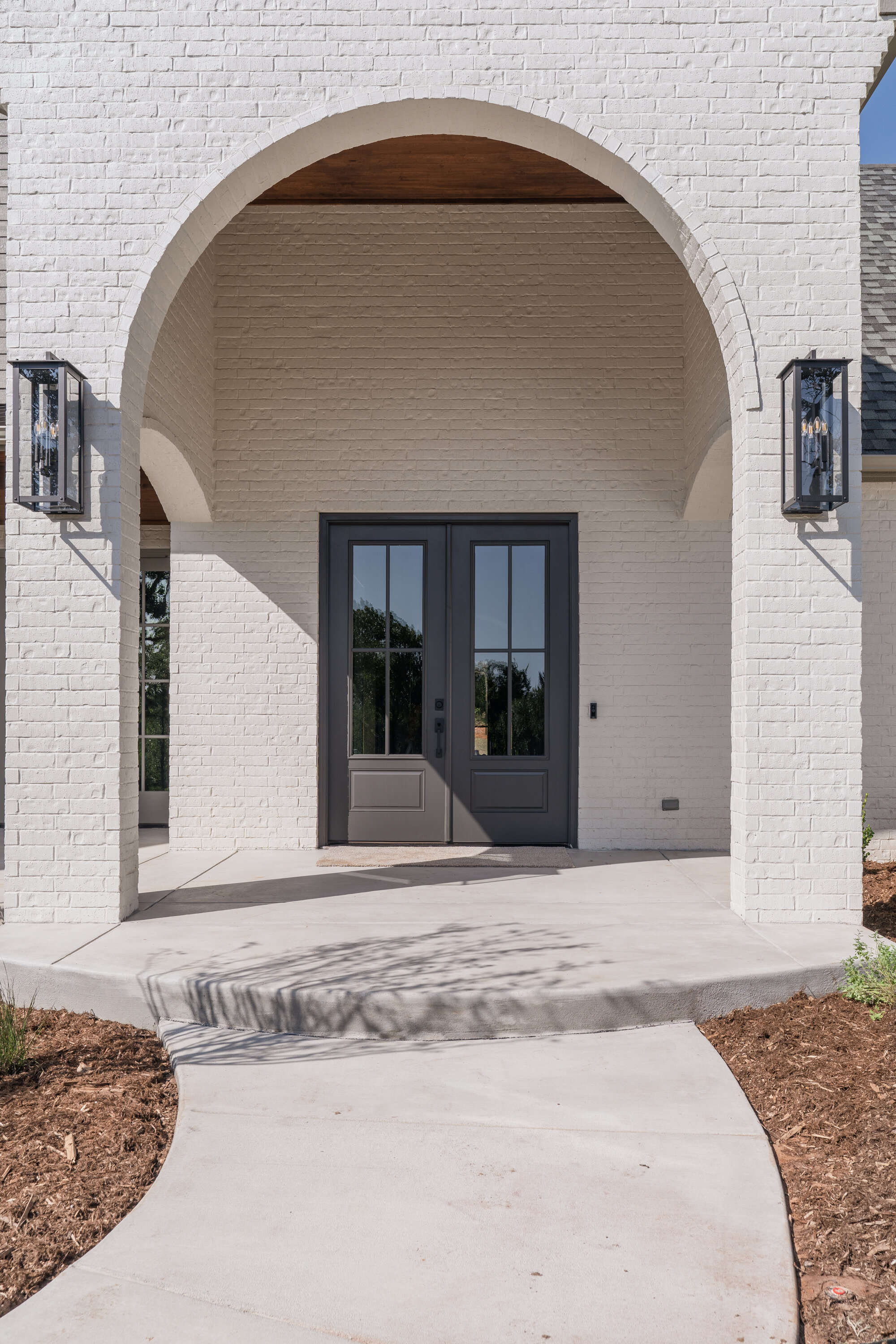 White arch front porch