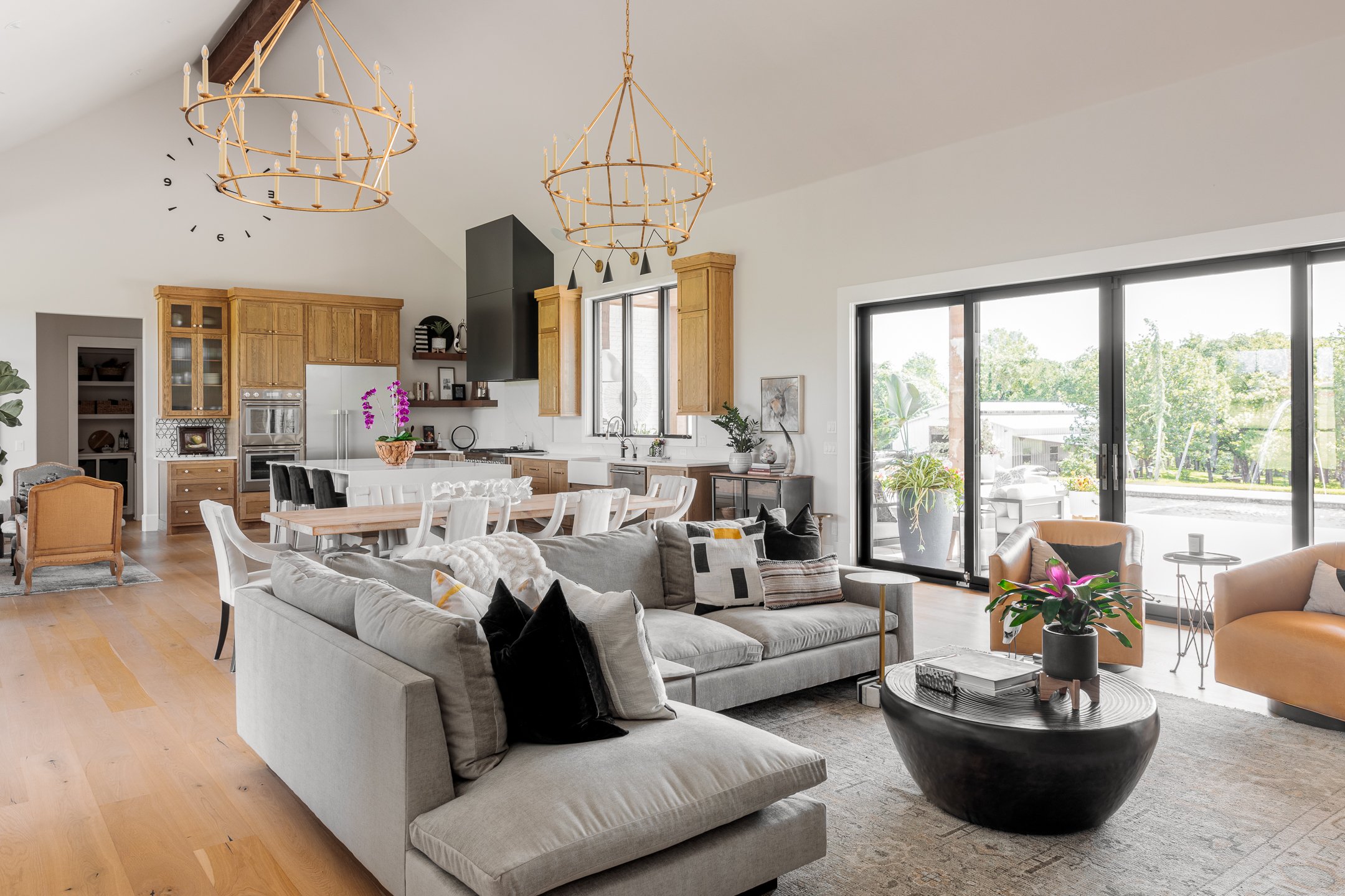 Gray couch and gold chandeliers 