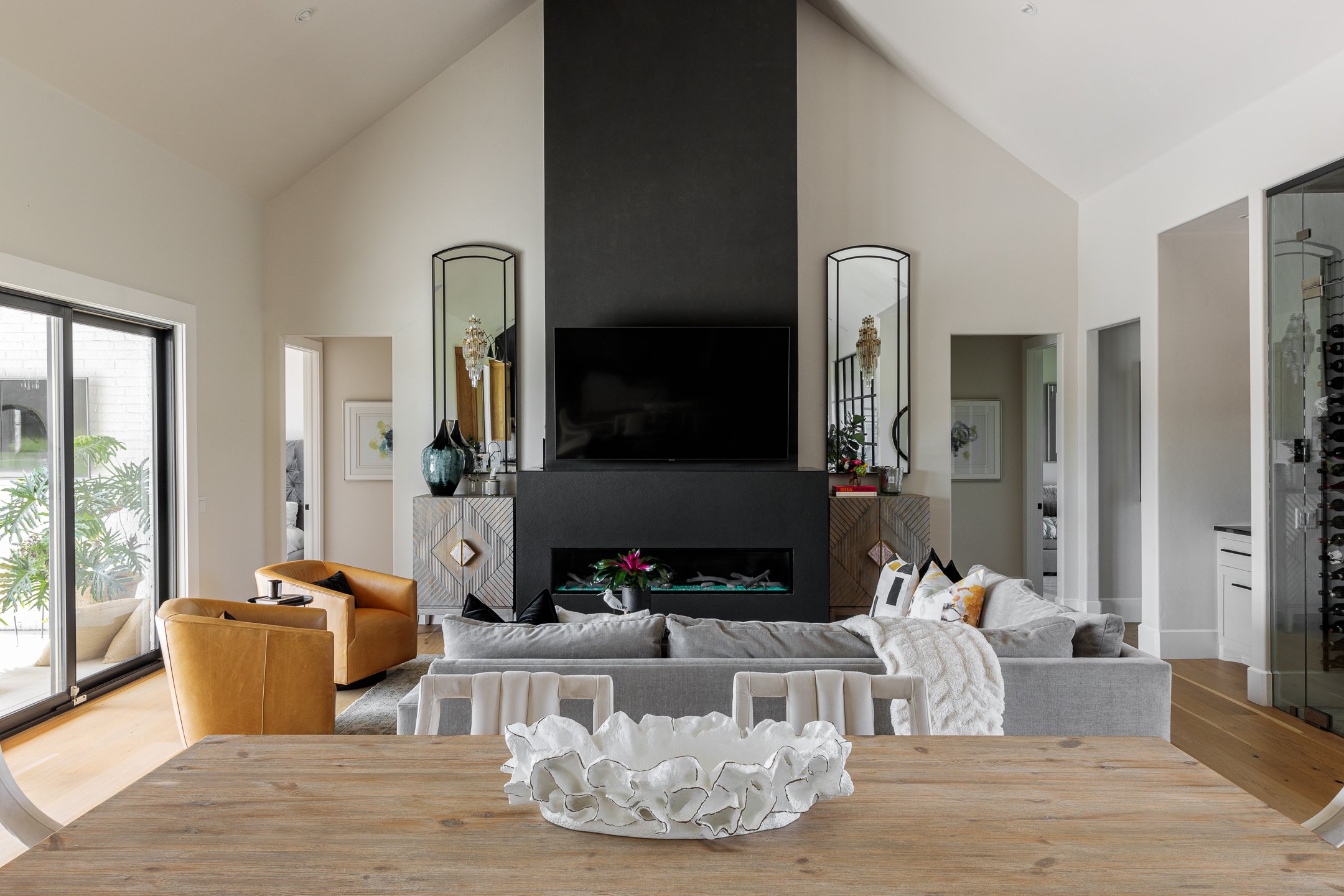 Open living room with black fireplace 