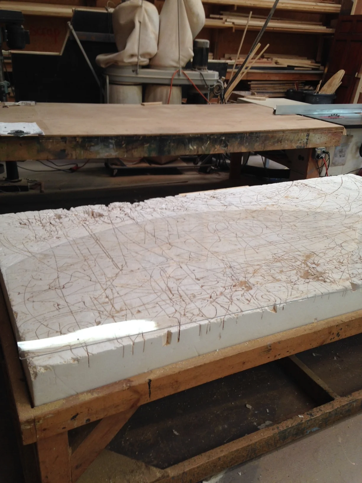  I cut out a piece of plexiglass using a jigsaw to fit in between the two sheets of plywood. 