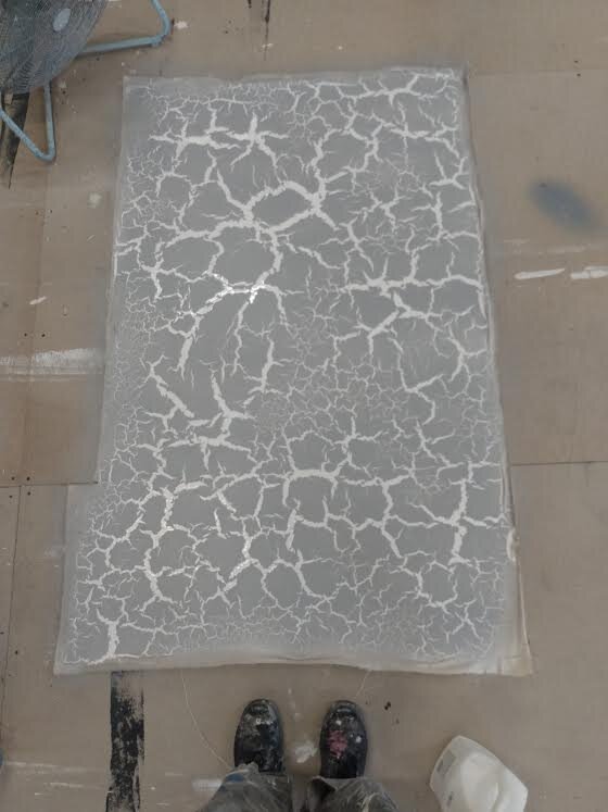  The main element of the show was a textured wall that when backlit, would show cracks all over the back wall. To do this we played with a lot of glue. This is a sample of primer sprayed over the glue. 