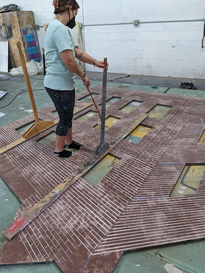  Lining each brick on the back buildings 