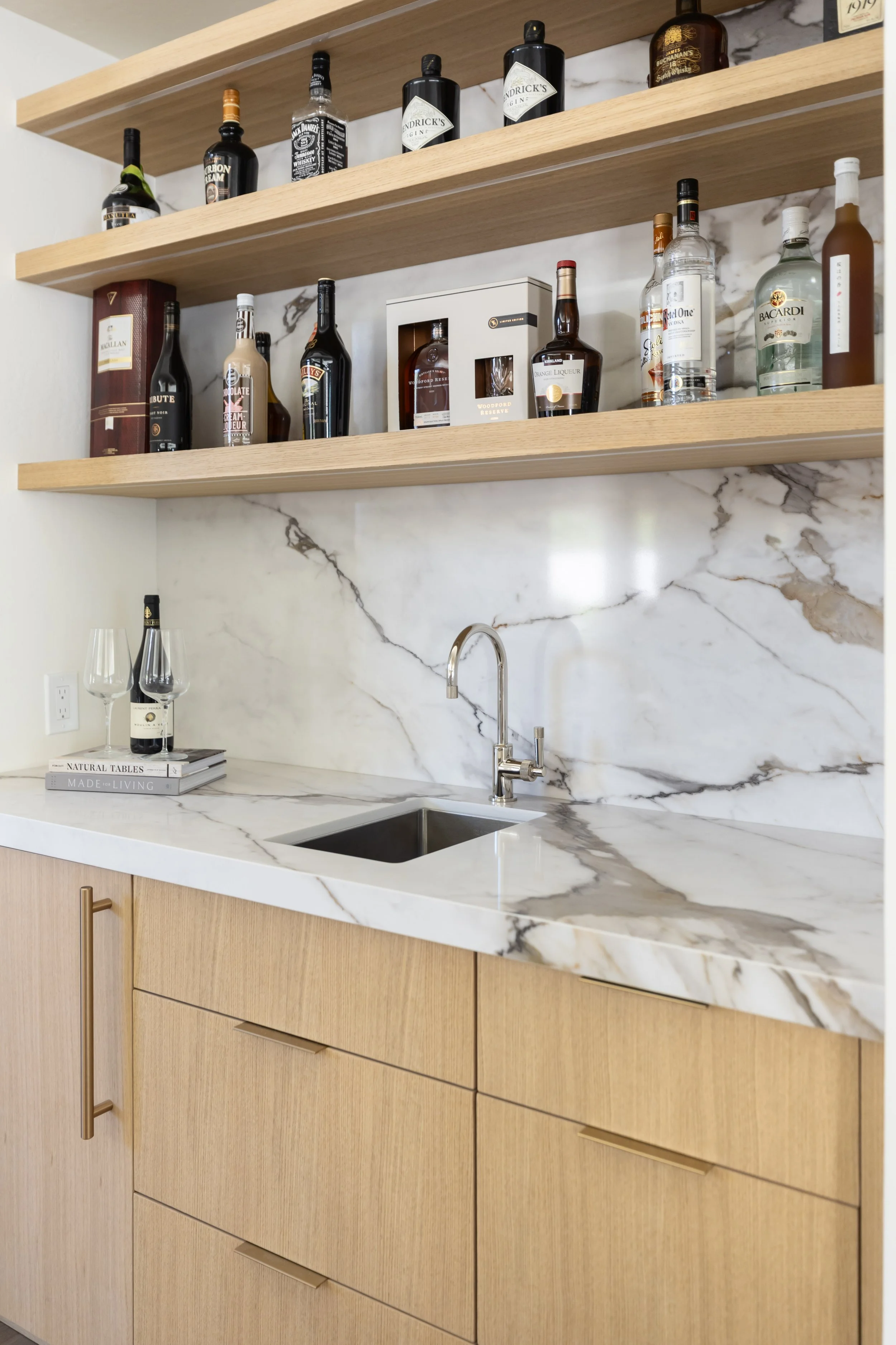 Custom illuminated bar integrated into the open living area of the renovated Arcadia home