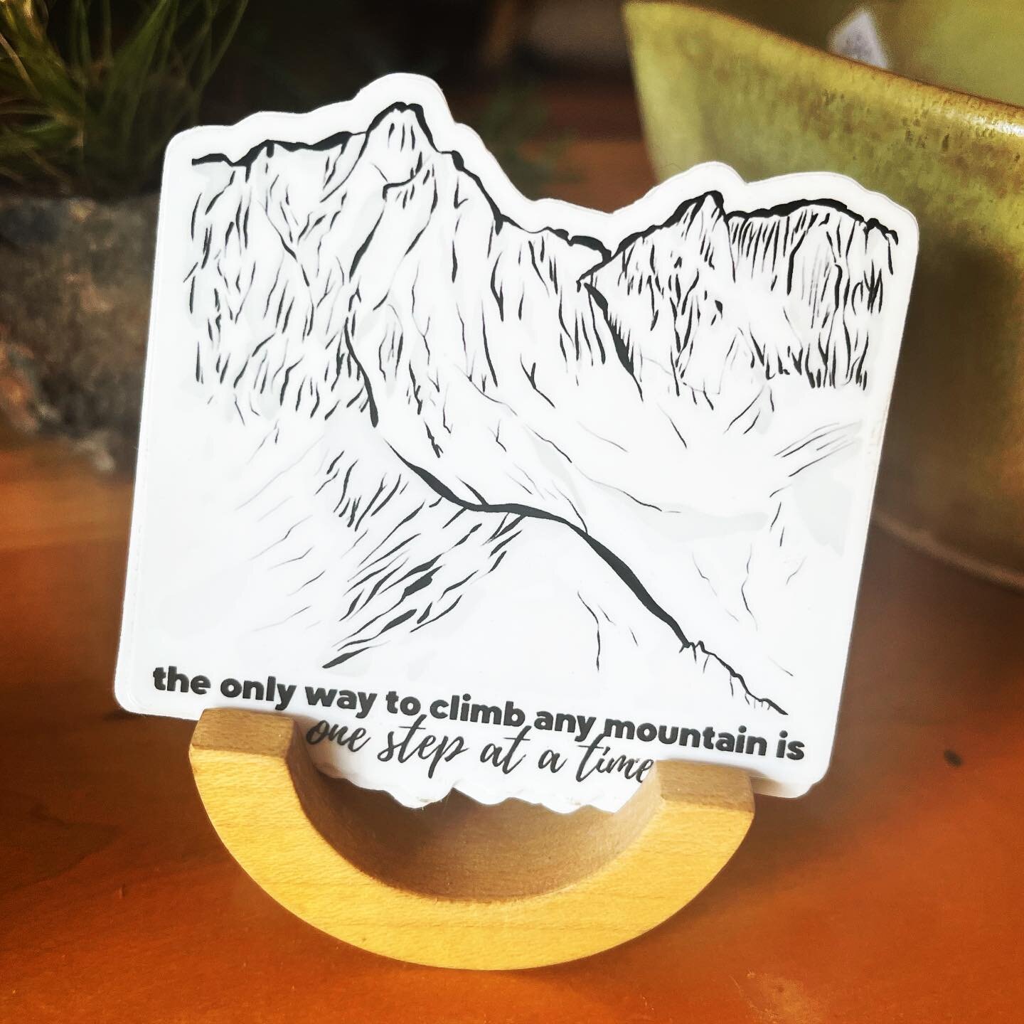 The only way to accomplish anything, whether climbing a mountain, finishing school, launching a business, or any other goal you may have, is taking it one step at a time.

This die-cut sticker was inspired by all of the literal and metaphorical mount
