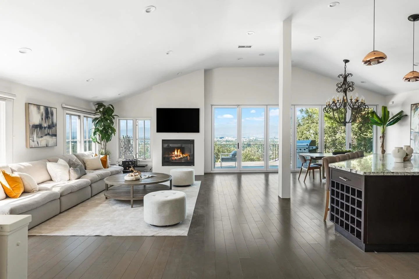 JUST LISTED 🌳 Perched in the tranquil hills of Studio City, this exceptional residence offers privacy, bright, open living spaces, and stunning panoramic views. There are multiple outdoor spaces including an expansive terrace featuring a built-in fi