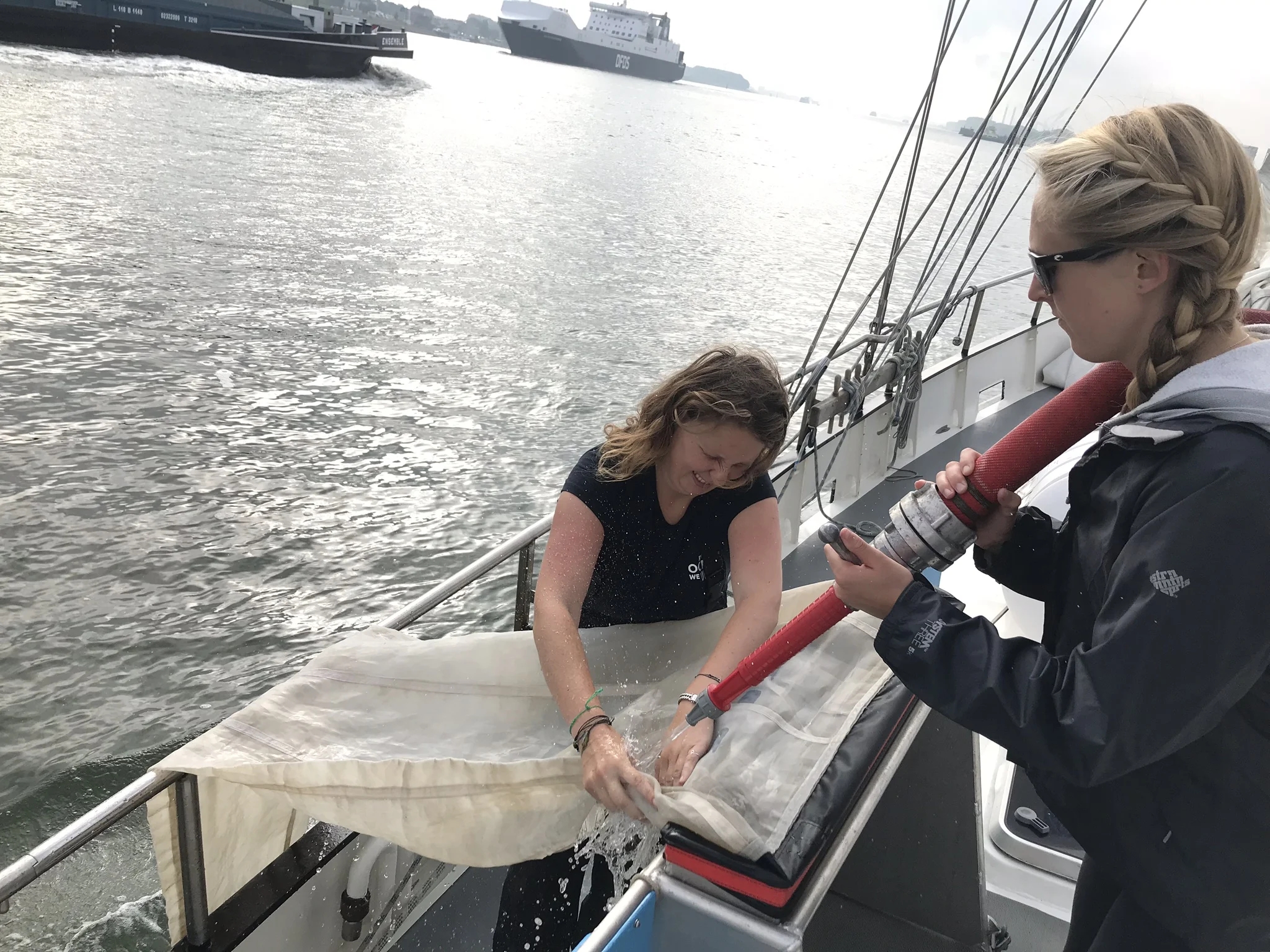 Roos and Katie Cleaning the Manta Trawl net