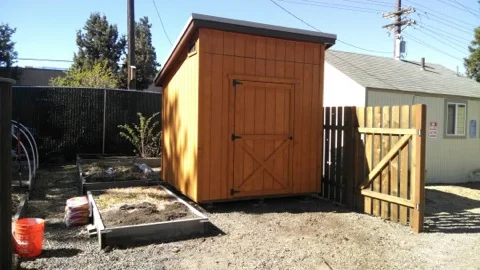 St. Vincent DePaul needed a bit of extra storage space. We build a functional (while still cute) space for them to maximize their storage. The stained T1-11 siding, shed roof, and barn door entrance this shed reaches the fullest potential for storage as well as aesthetics.