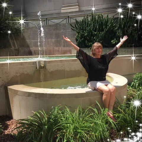 Cindy Senarighi sitting near a water fountain