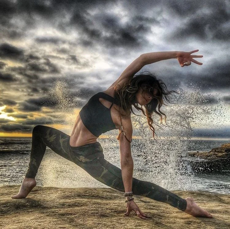 Liz Corwin yoga pose on beach