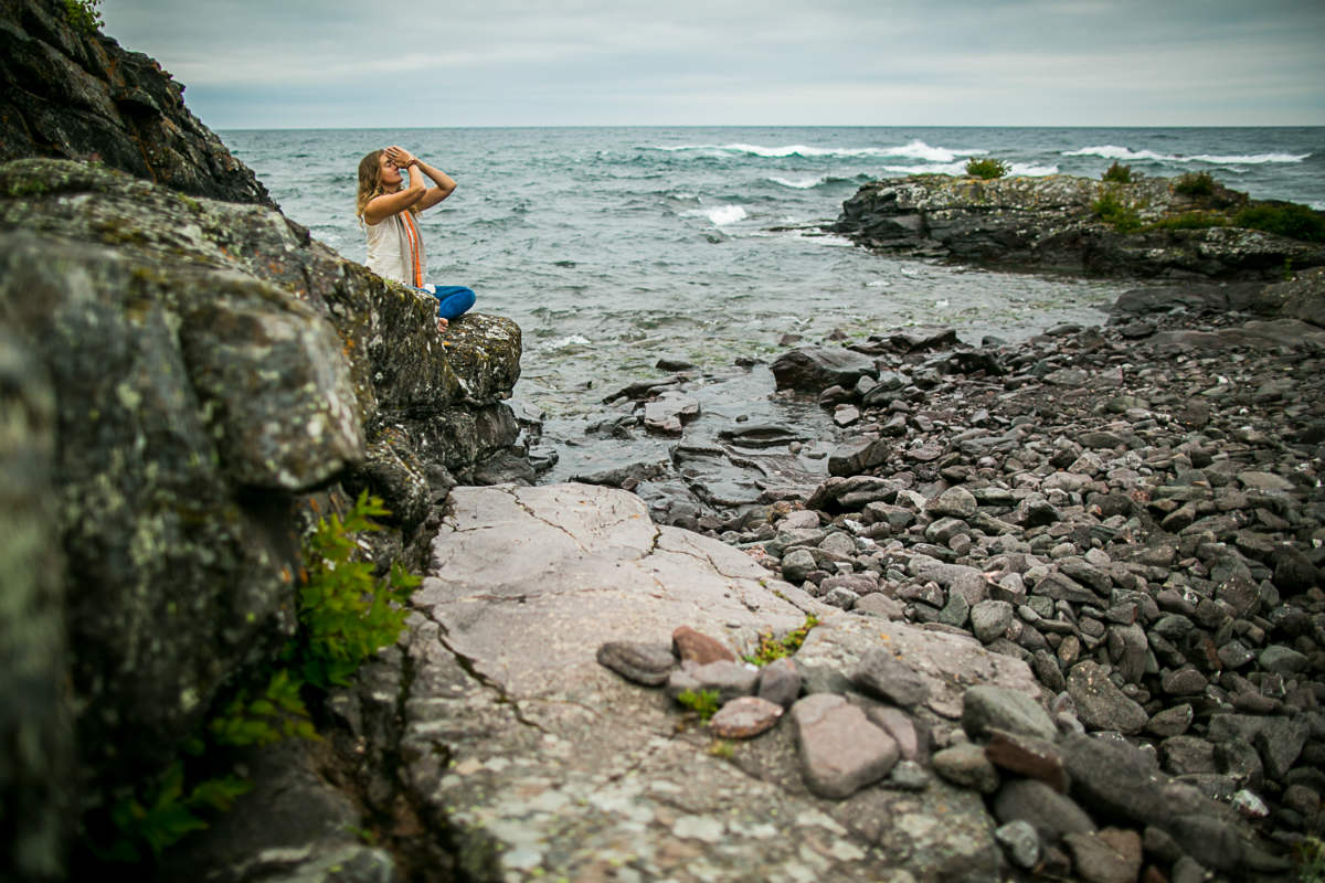 Amie Heeter meditating at Lake Superior