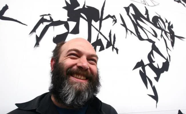Above: Artist Carlos Amorales with his work Black Cloud